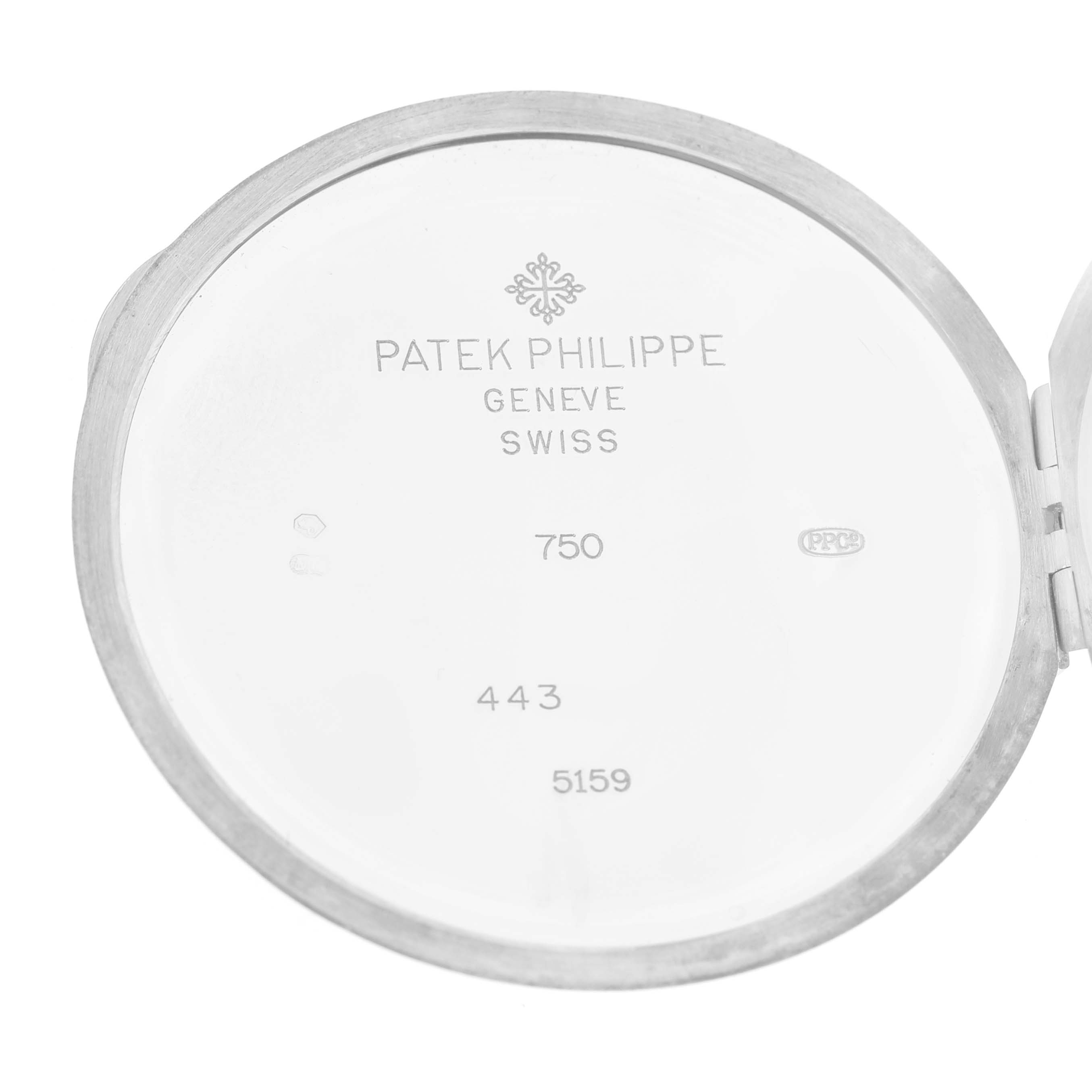 The image shows the inside of a watch case back for the Patek Philippe Complications 5159G-001 Men's White Gold Silver Dial model, featuring the brand's markings and serial numbers.