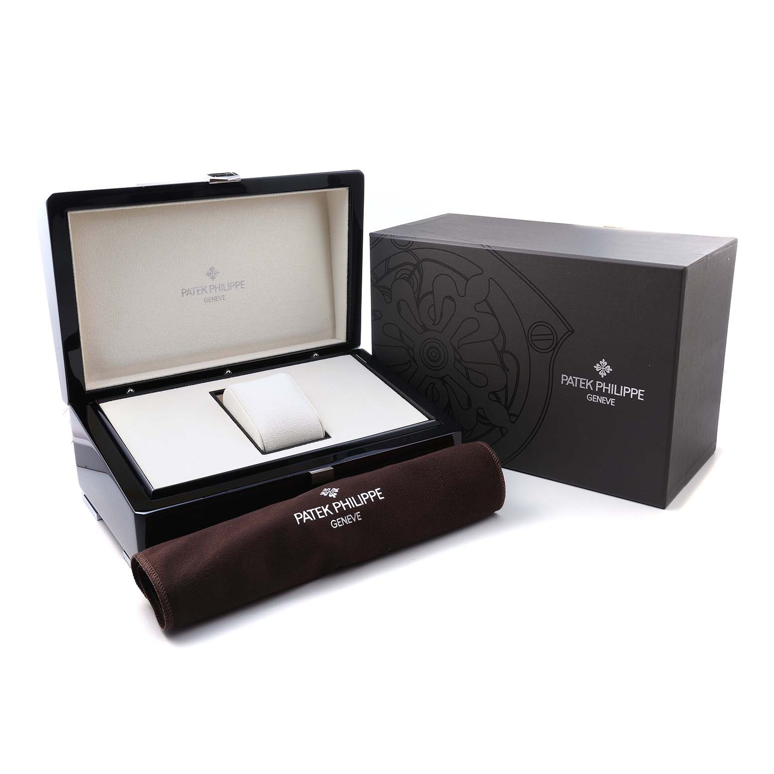 The Patek Philippe Complications 5159G-001 Men's White Gold Silver Dial model packaging is shown at an angle displaying the open box, outer box, and a cleaning cloth.