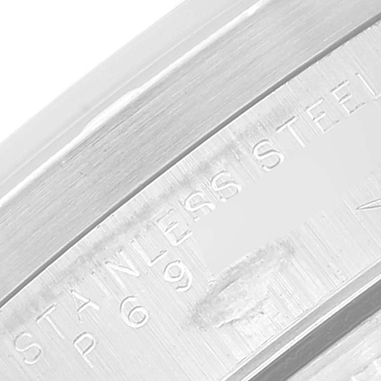 The image shows a close-up of the case back edge of a Rolex Air-King 14010 Men's Stainless Steel Black Dial 14010 Men's Stainless Steel Black Dial watch, highlighting the "STAINLESS STEEL" engraving.