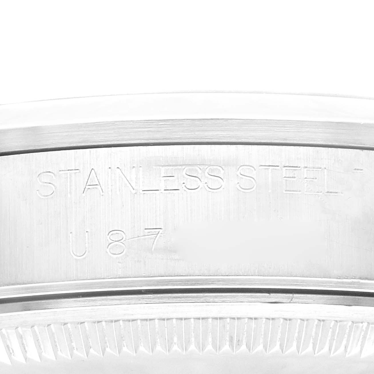 This image shows a close-up of the stainless steel case back of a Rolex Air-King 14000M Men's Stainless Steel Blue Dial 14000M Men's Stainless Steel Blue Dial watch.