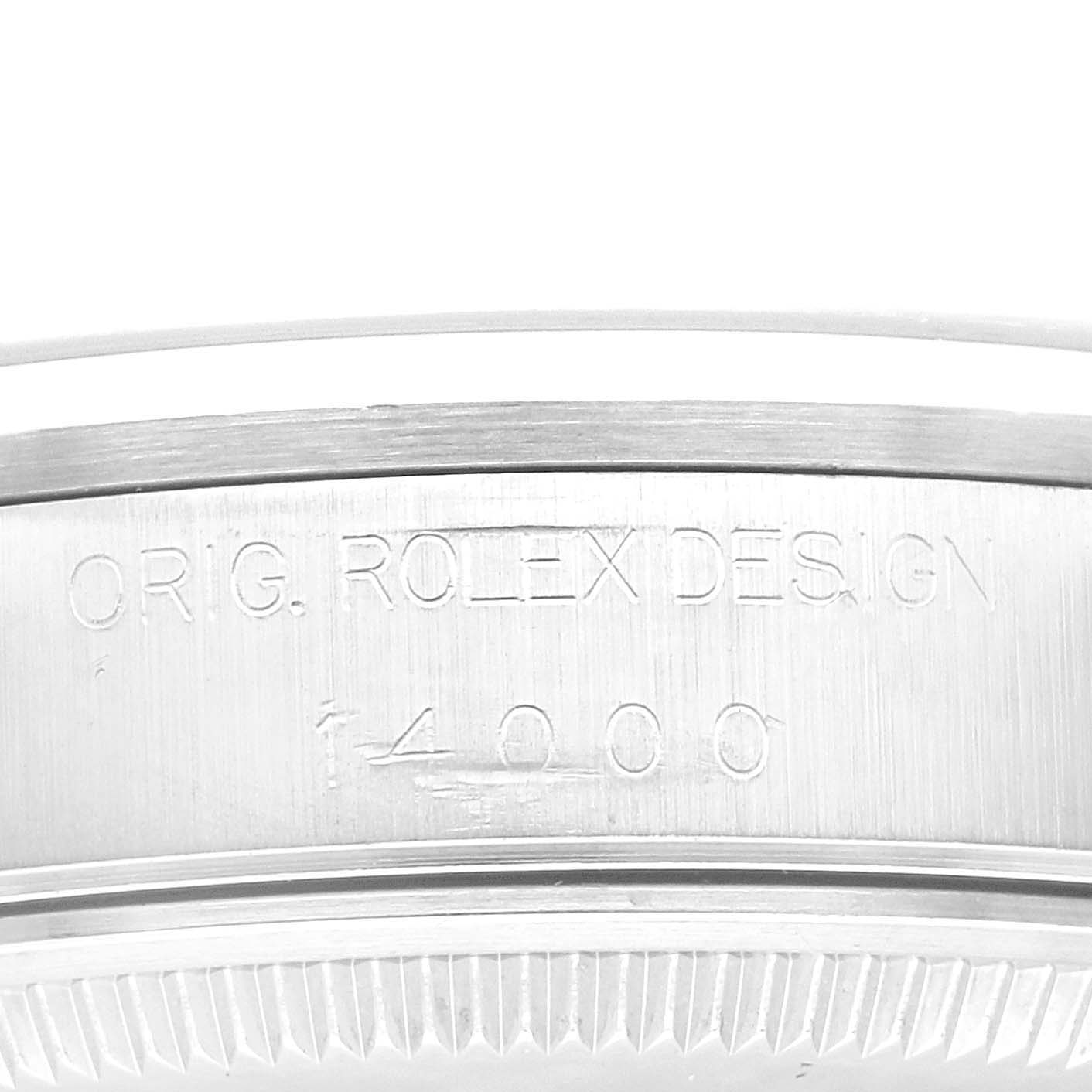 This close-up image shows the side of the case back of the Rolex Air-King 14000M Men's Stainless Steel Blue Dial 14000M Men's Stainless Steel Blue Dial watch with engravings visible.