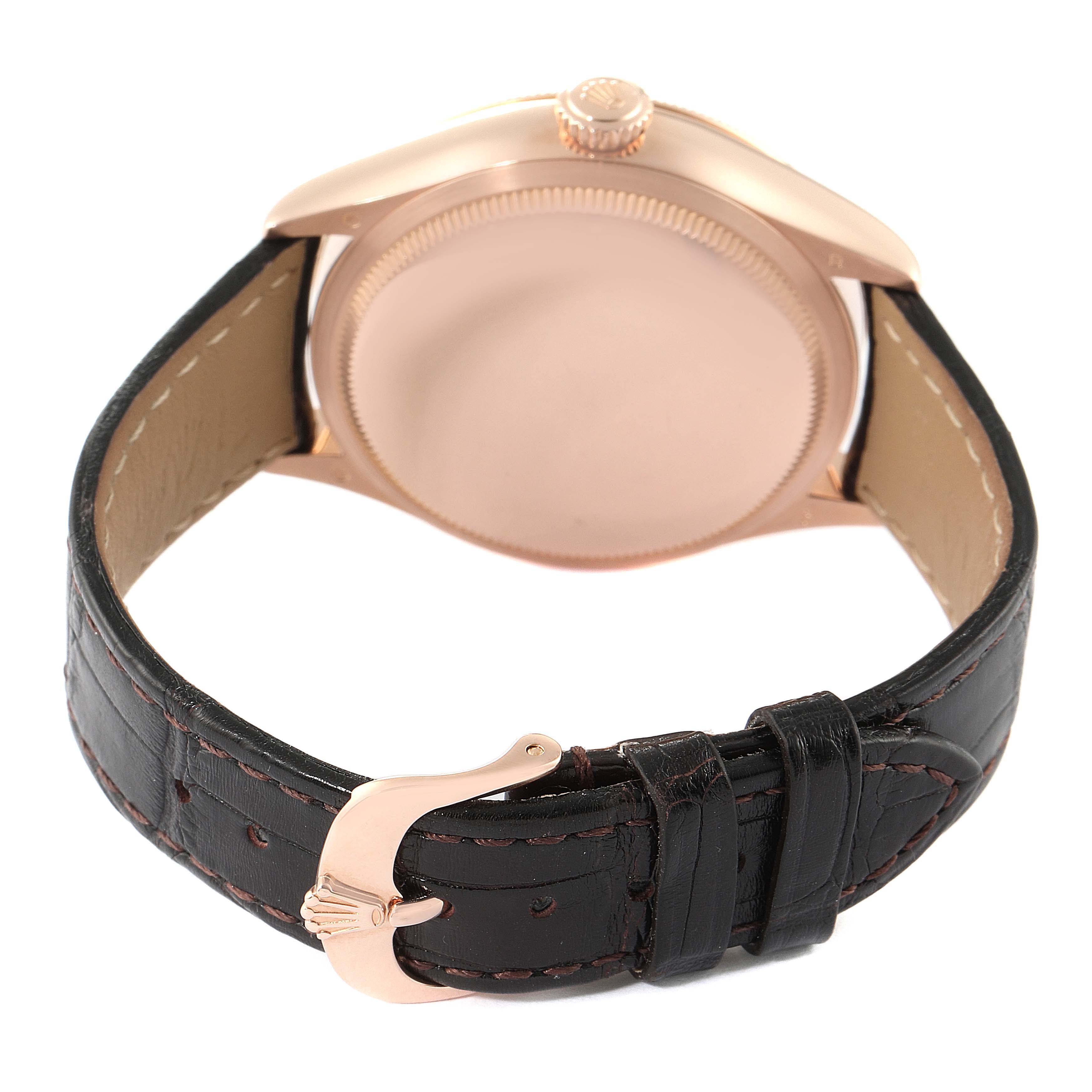 This image shows the back view of a Rolex Cellini 50515 Men's Rose Gold Silver Dial 50515 Men's Rose Gold Silver Dial watch, highlighting its case back, crown, and black leather strap with a clasp.