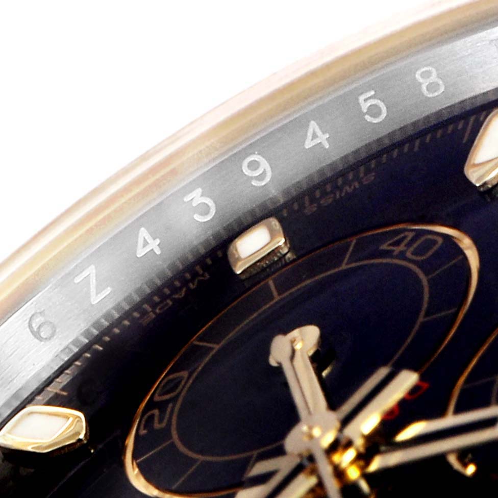 The image shows a close-up angle of the face and bezel of a Rolex Daytona 116503 Men's Steel and Gold (two tone) Black Dial 116503 Men's Steel and Gold (two tone) Black Dial watch, focusing on the numbers and part of the sub-dials.