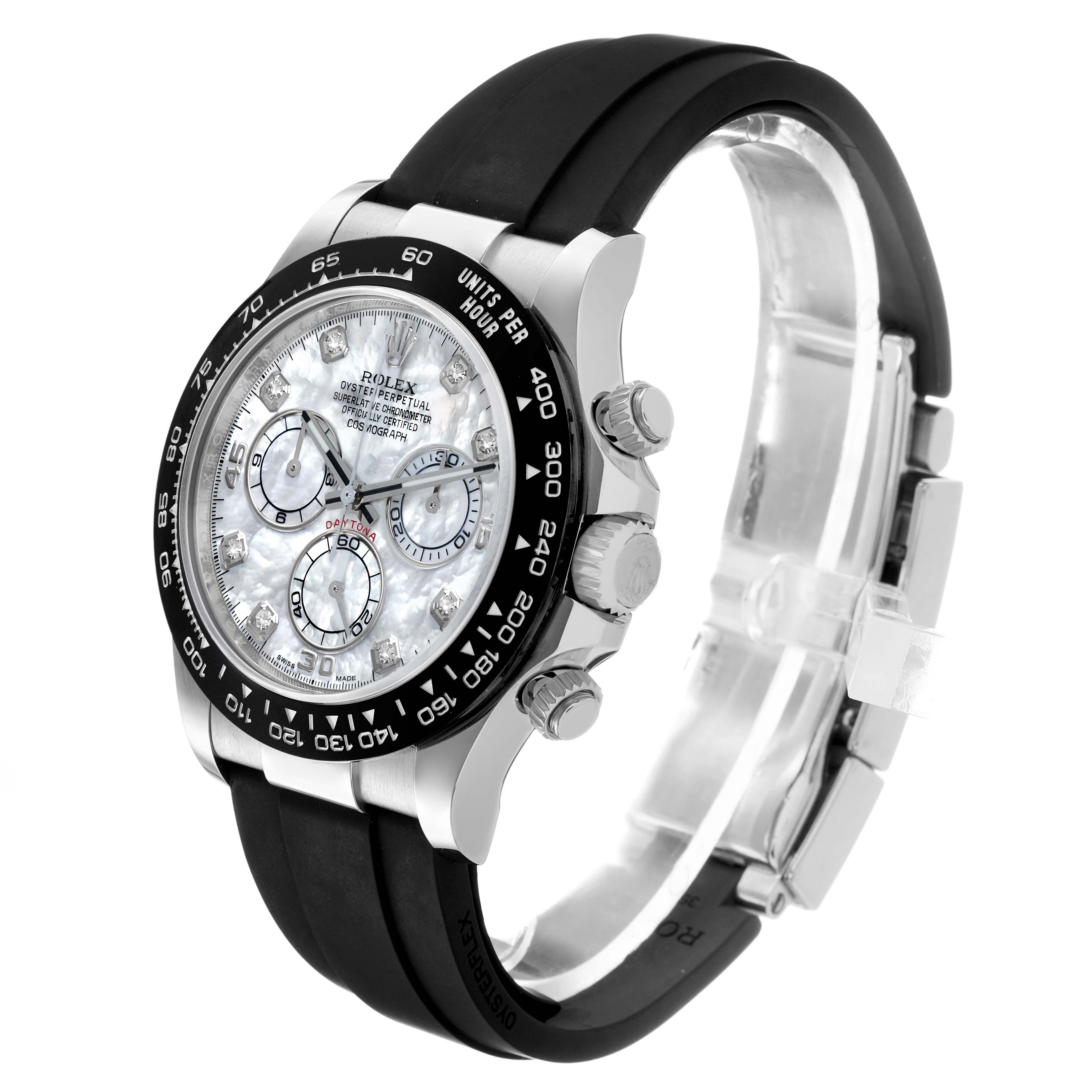 The Rolex Daytona 116519LN Men's White Gold Mother of Pearl Dial watch is shown at a 3/4 angle, highlighting the face, bezel, pushers, crown, and rubber strap.