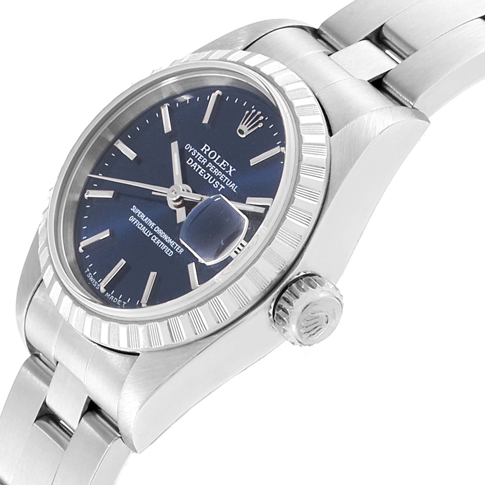 The image shows a side angle of a Rolex Date 69240 Women
s Stainless Steel Blue Dial 69240 Women
s Stainless Steel Blue Dial Datejust watch, highlighting the crown, bezel, dial, and part of the bracelet.