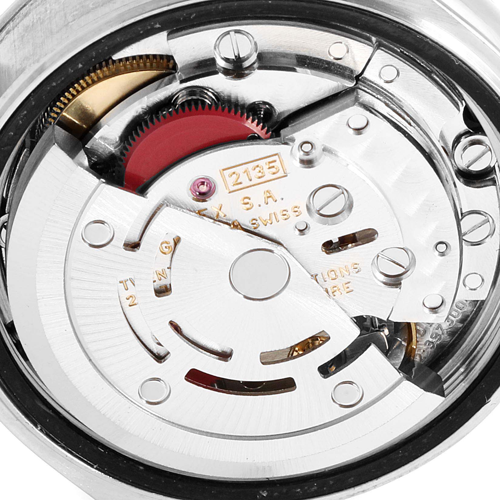 This image shows the internal mechanism of a Rolex Date 69240 Women
s Stainless Steel Blue Dial 69240 Women
s Stainless Steel Blue Dial model watch, displaying gears and the rotor assembly.