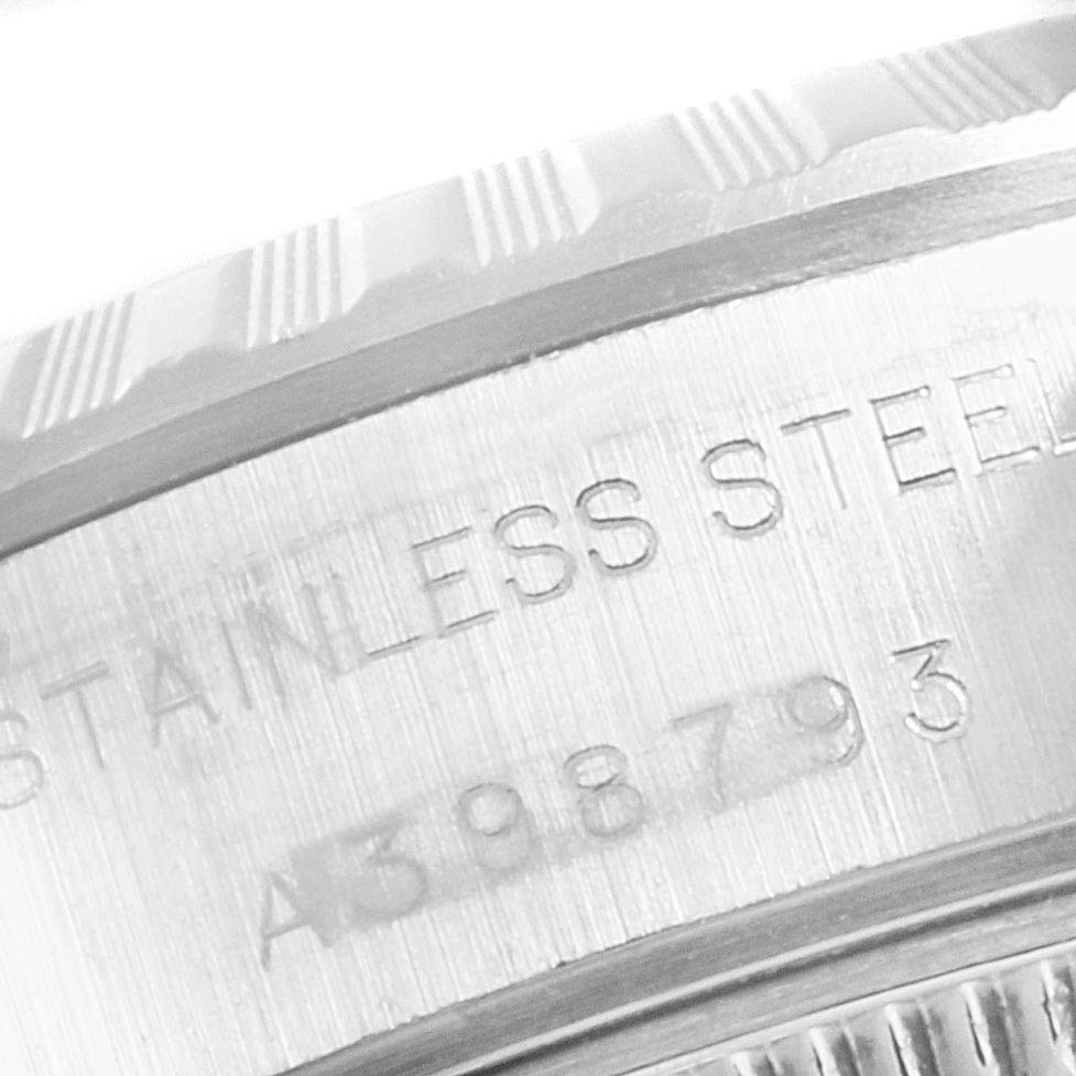 The image shows a close-up of the engraved stainless steel casing and part of the bezel of a Rolex Date 69240 Women
s Stainless Steel Blue Dial 69240 Women
s Stainless Steel Blue Dial model watch.