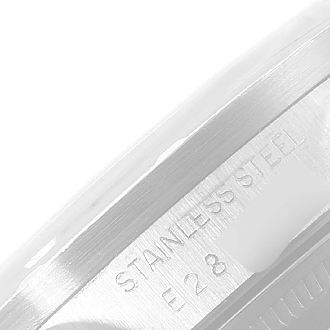 This close-up shows the stainless steel case side of the Rolex Date 15210 Men's Stainless Steel Silver Dial 15210 Men's Stainless Steel Silver Dial model with engraving visible.