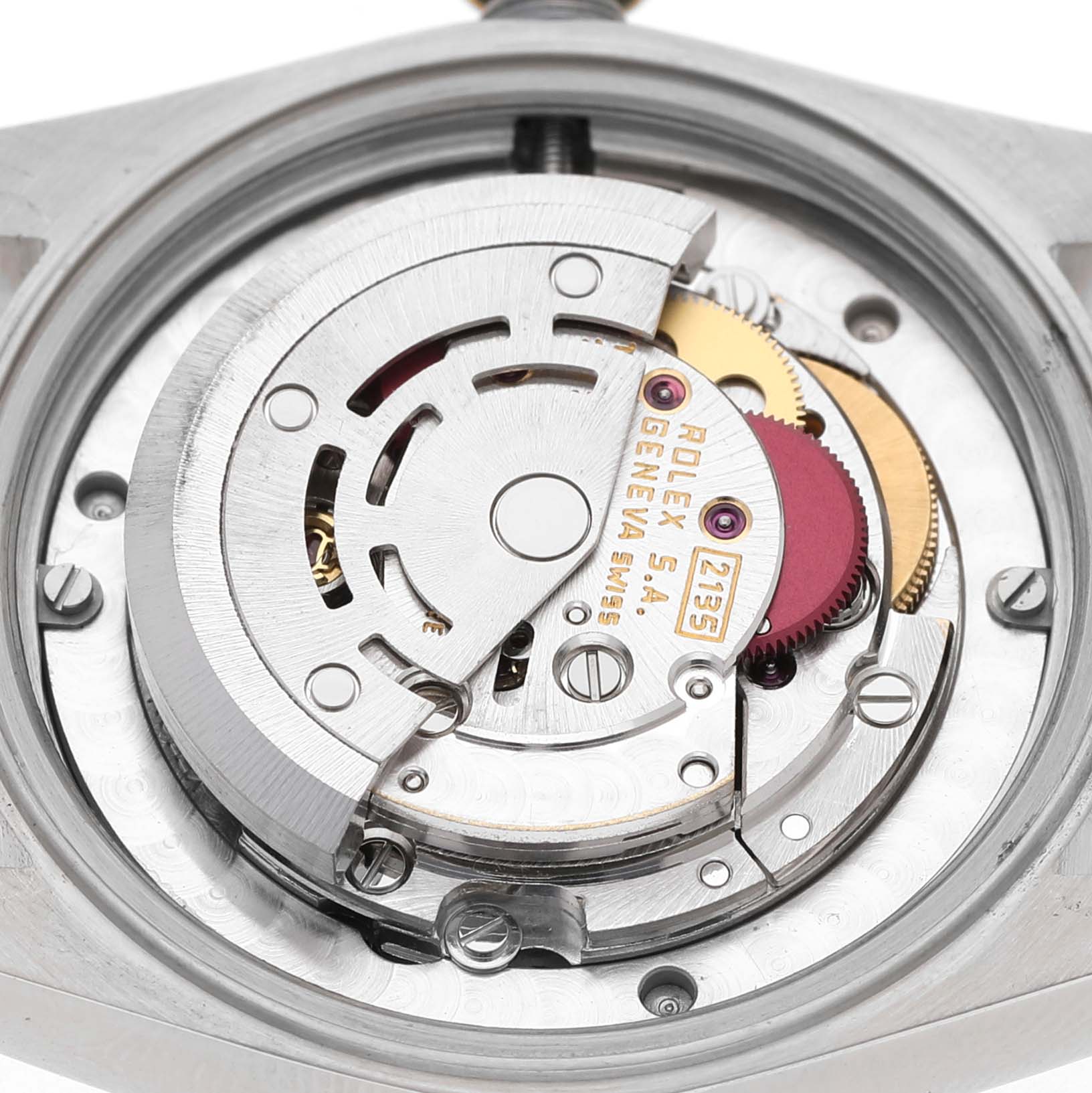 The image shows the movement of a Rolex Mid-Size 68273 Women's Steel and Gold (two tone) White Dial watch, highlighting intricate mechanical parts from a top-down angle.