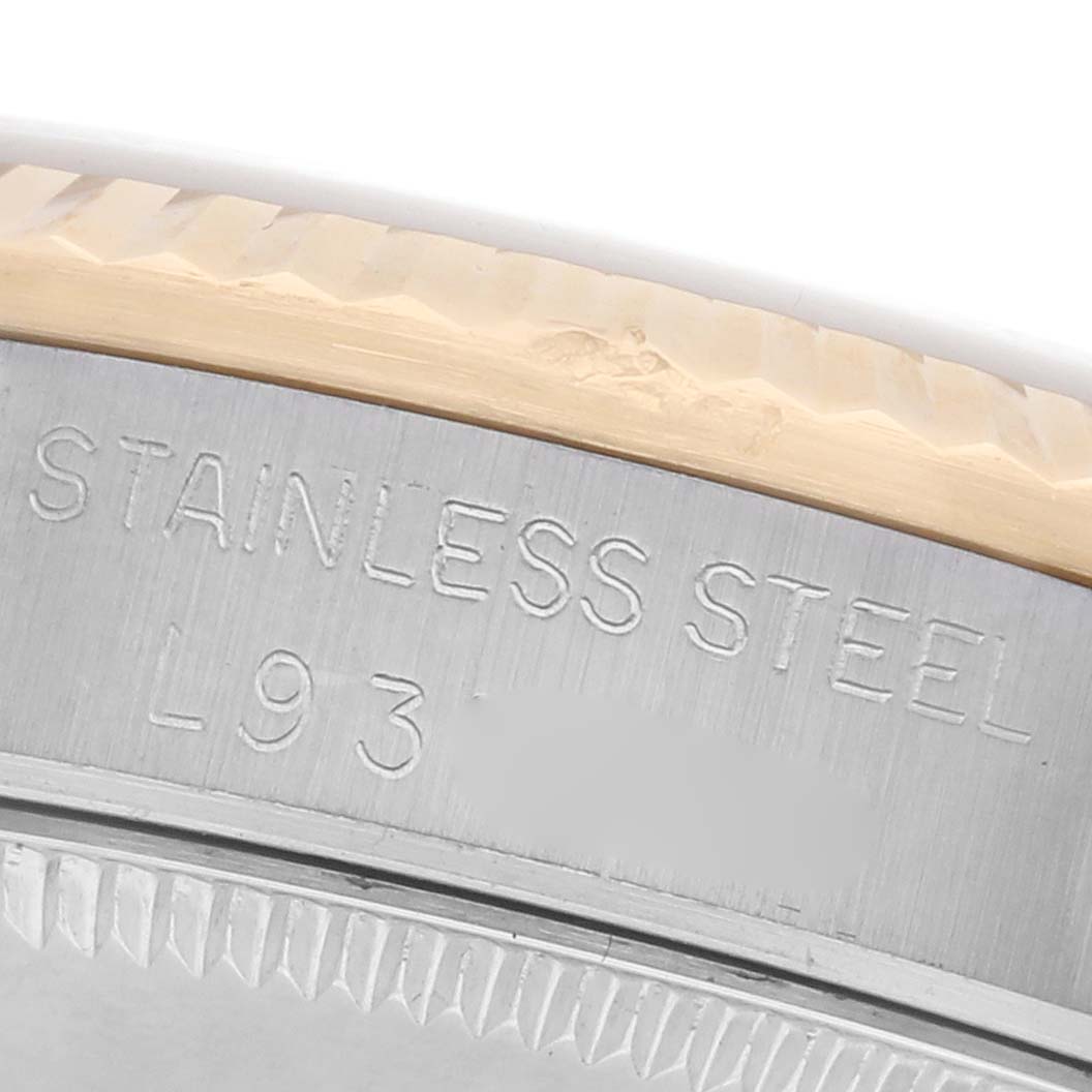 The image shows a close-up of the side of a Rolex Mid-Size 68273 Women's Steel and Gold (two tone) Champagne Dial 68273 Women's Steel and Gold (two tone) Champagne Dial watch, highlighting the stainless steel part and edge details.