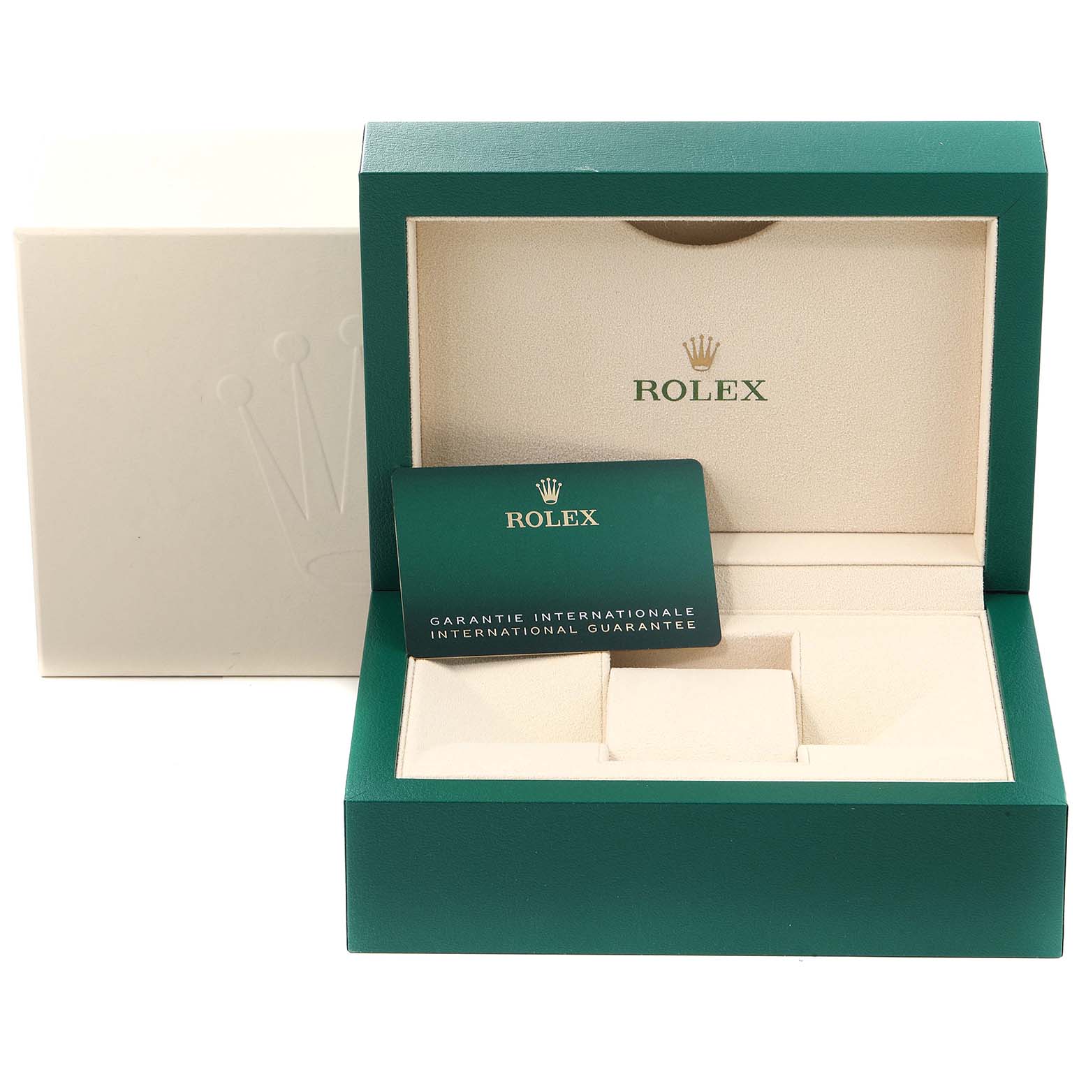 The image shows the open box of a Rolex Datejust 126200 Men
s Stainless Steel Black Dial 126200 Men
s Stainless Steel Black Dial with a green and beige interior and a guarantee card inside.