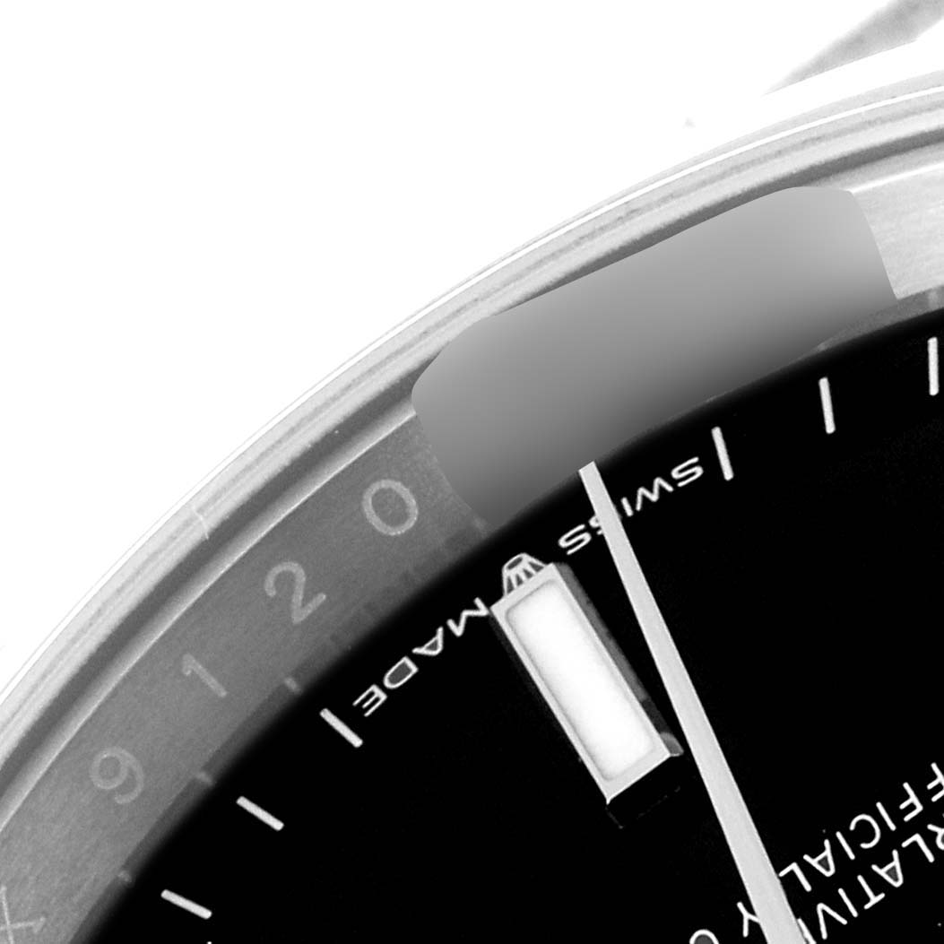 The image shows a close-up of the dial and date indicator of a Rolex Datejust 126200 Men
s Stainless Steel Black Dial 126200 Men
s Stainless Steel Black Dial watch, focused on the "Swiss Made" label.