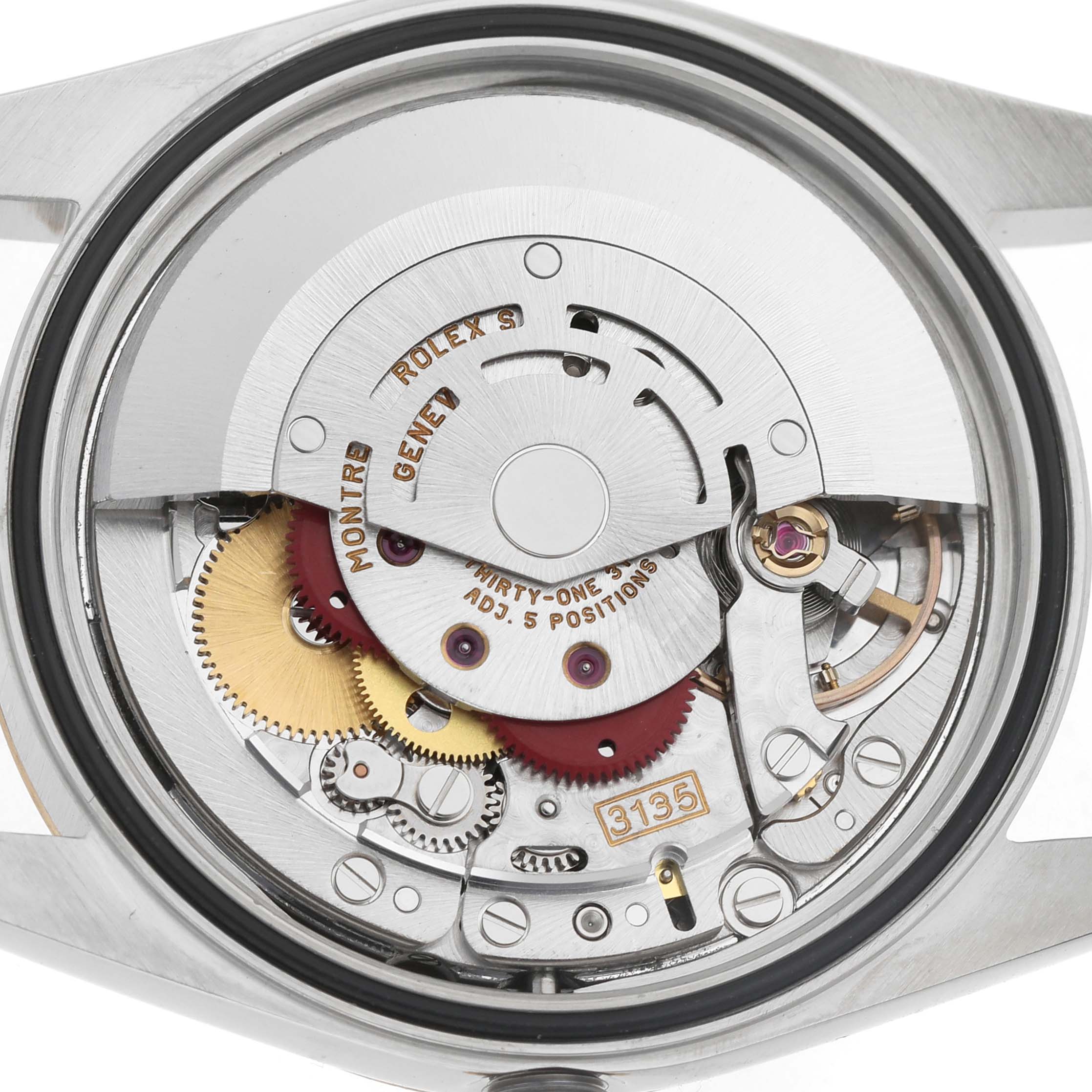 The image shows the Rolex Datejust 16233 Men's Steel and Gold (two tone) Champagne Dial movement from a back view, displaying the rotor, gears, and intricate components.