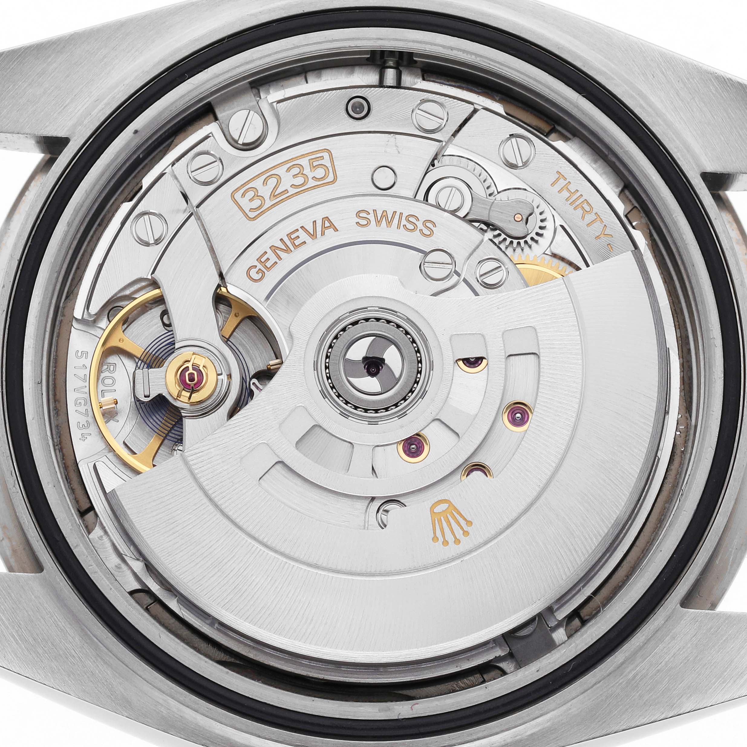 The image shows the movement of a Rolex Datejust 41 126334 Men's Stainless Steel Grey Dial 126334 Men's Stainless Steel Grey Dial, highlighting the rotor and intricate components from a rear angle.