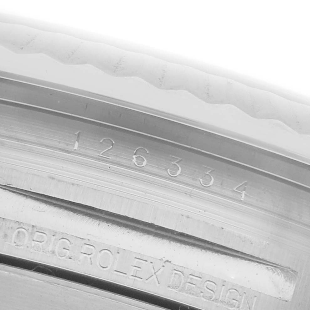 The image shows the engraving on the inner bezel of a Rolex Datejust 41 126334 Men's Stainless Steel Grey Dial 126334 Men's Stainless Steel Grey Dial, including model and design details.