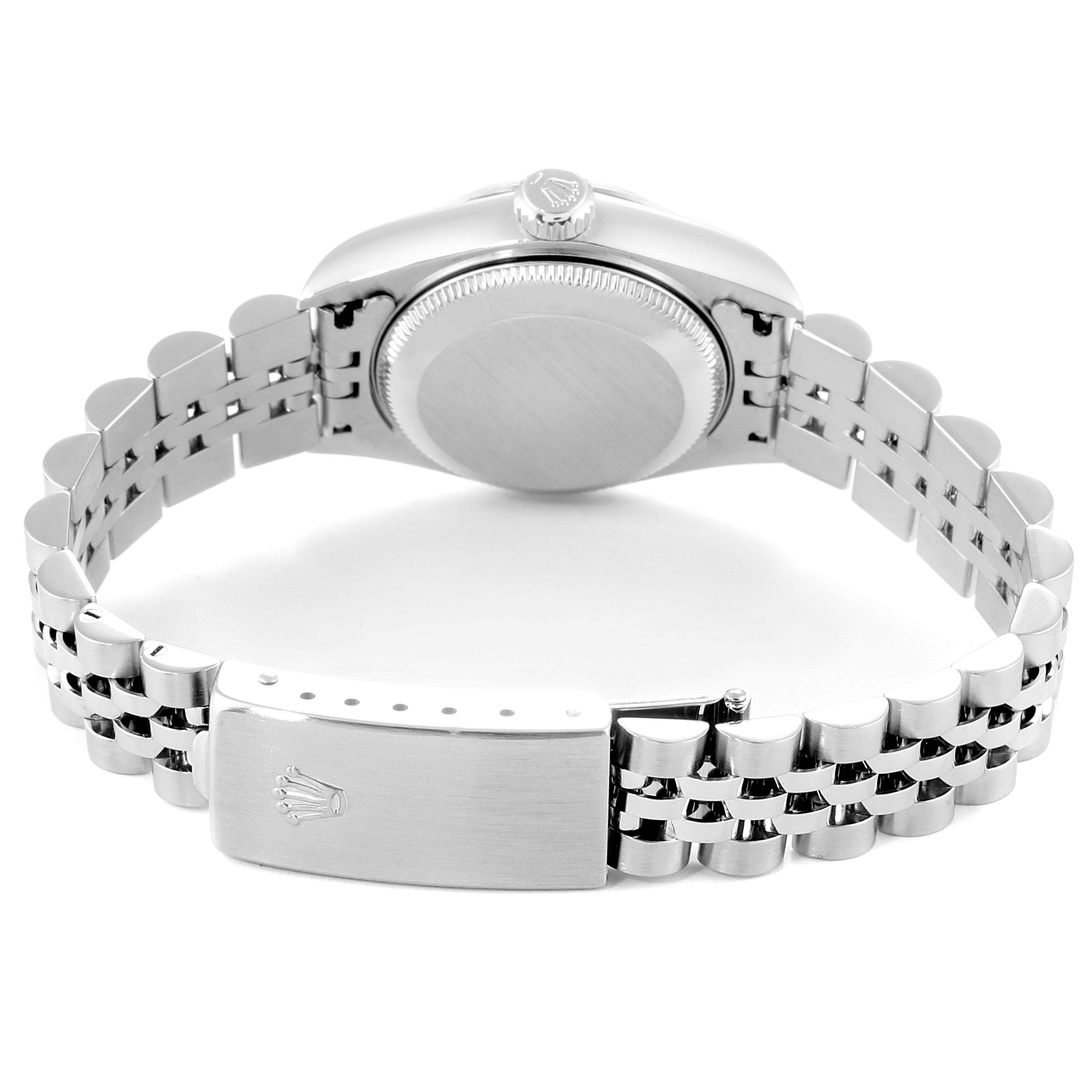 The image shows the back of the Rolex Datejust 79174 Women
s Stainless Steel Blue Dial 79174 Women
s Stainless Steel Blue Dial watch, focusing on the clasp, bracelet, and the watch case back.