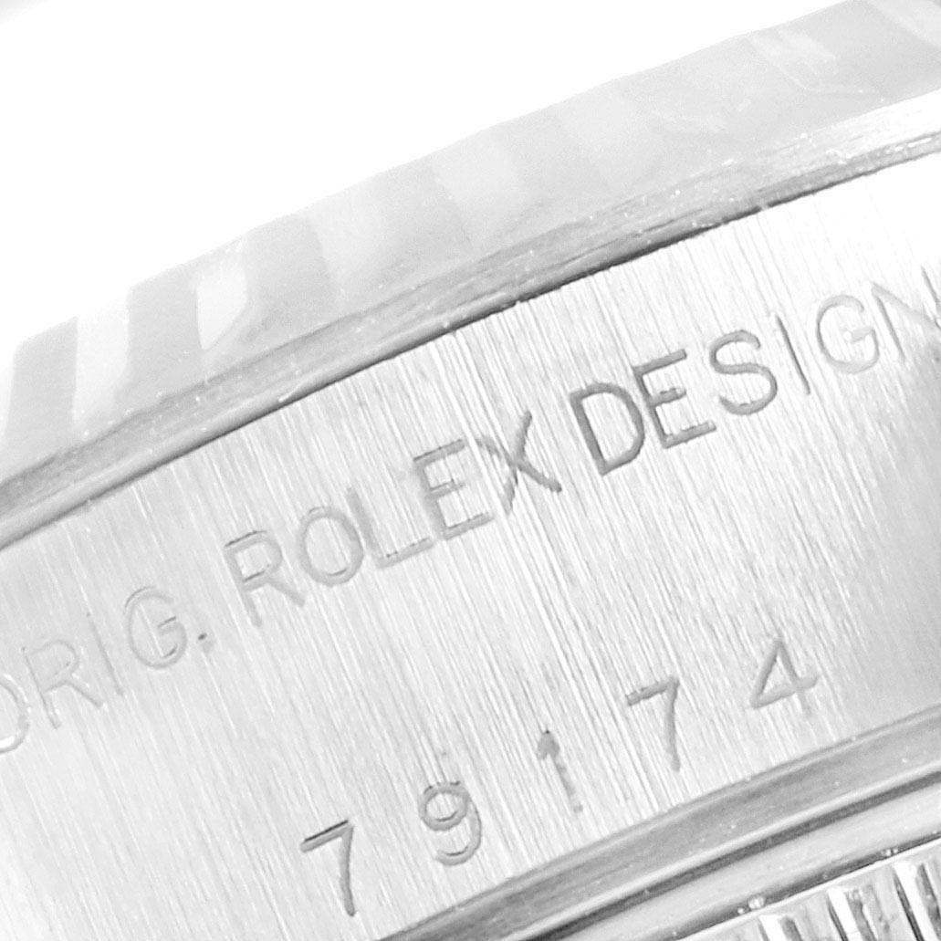 This image shows a close-up of the engraved side of a Rolex Datejust 79174 Women
s Stainless Steel Blue Dial 79174 Women
s Stainless Steel Blue Dial watch case, displaying the model number and brand name.