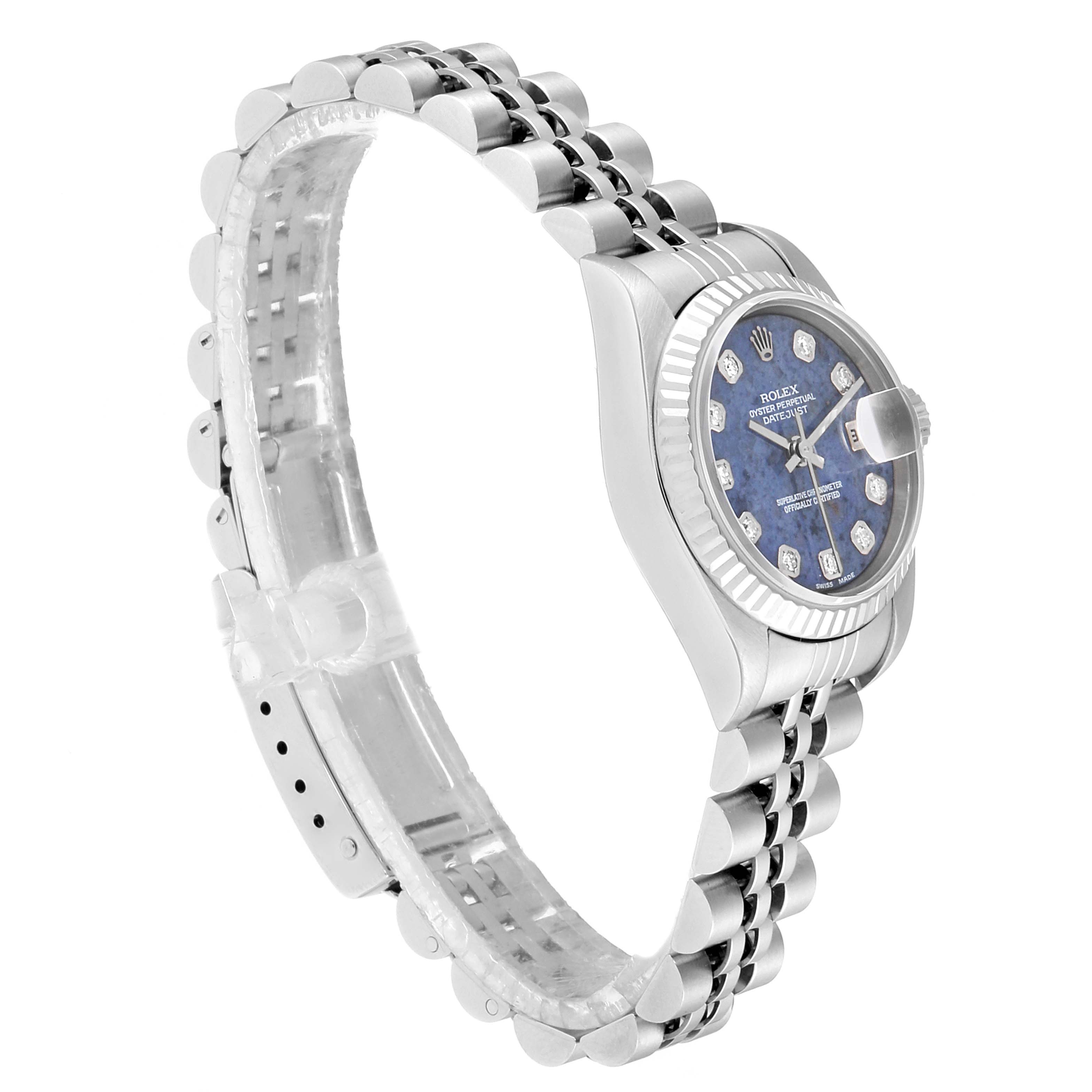 The image shows a Rolex Datejust 79174 Women
s Stainless Steel Blue Dial 79174 Women
s Stainless Steel Blue Dial watch from a side angle, highlighting its bracelet and face.