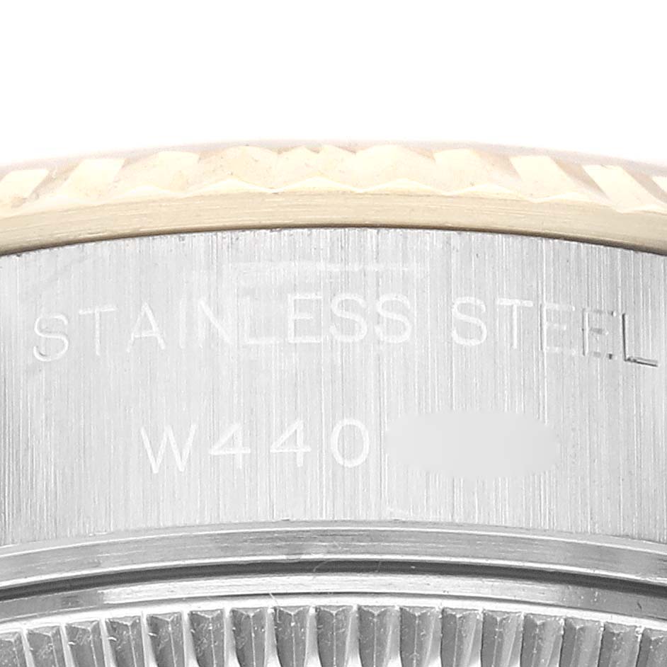 The image shows a close-up of the side engraving on the stainless steel case of a Rolex Datejust 69173G Women's Steel and Gold (two tone) Champagne Dial 69173G Women's Steel and Gold (two tone) Champagne Dial watch.