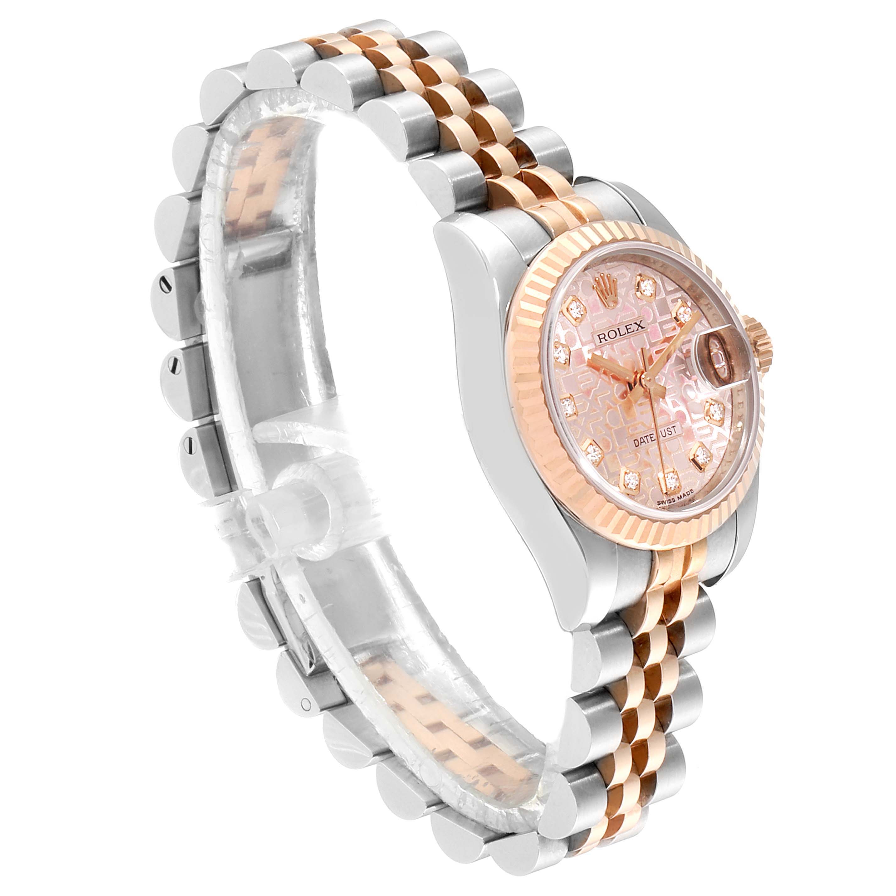 The image shows a Rolex Datejust 179171 Women
s Steel and Gold (two tone) Pink Dial 179171 Women
s Steel and Gold (two tone) Pink Dial watch at an angled side view, highlighting its dial, bezel, and two-tone bracelet.