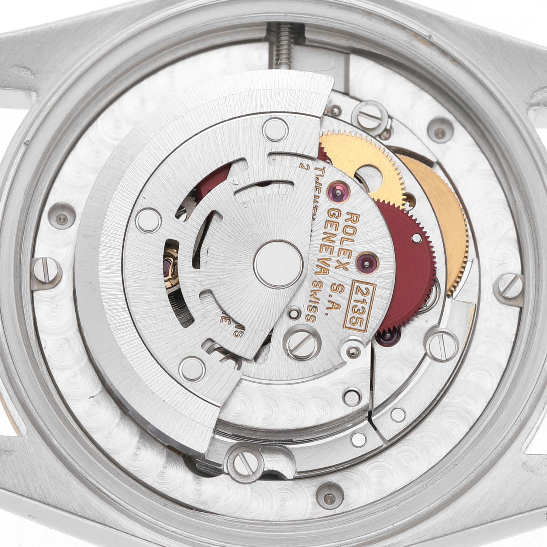 The image shows the internal mechanism of a Rolex Mid-Size 68273 Women's Steel and Gold (two tone) Champagne Dial watch, including the rotor and gears from a top-down view.