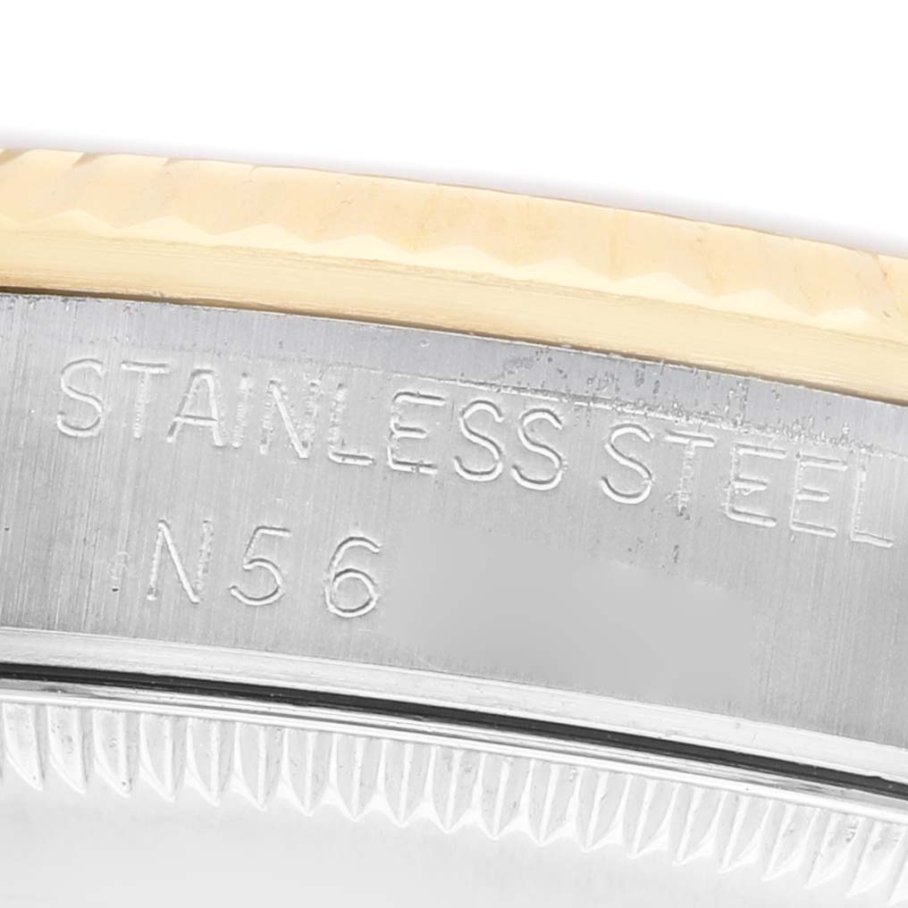 The image shows a close-up of the case back edge of a Rolex Mid-Size 68273 Women's Steel and Gold (two tone) Champagne Dial watch, highlighting the "Stainless Steel" engraving.