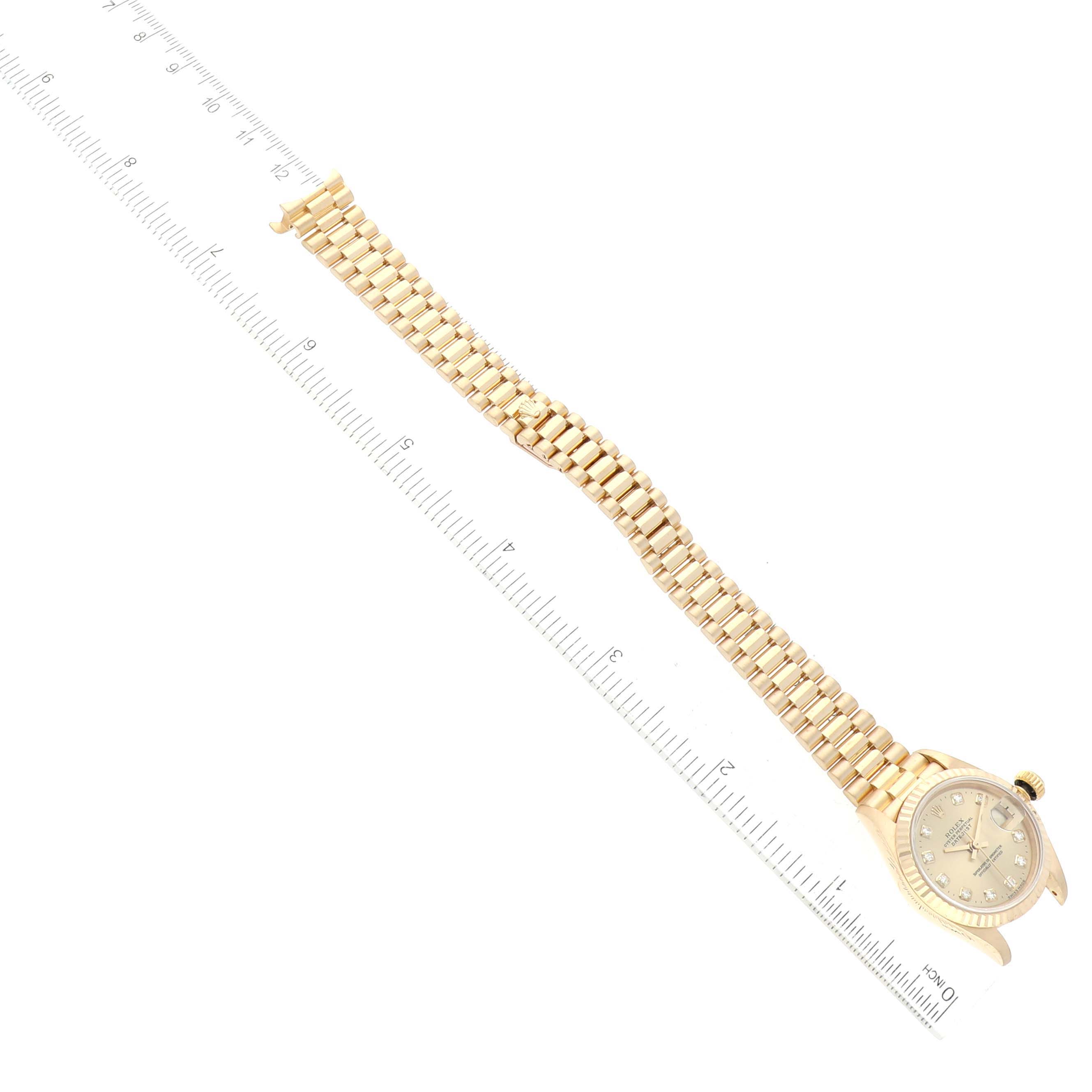 The Rolex President 69178 Women's Yellow Gold Champagne Dial 69178 Women's Yellow Gold Champagne Dial model watch is shown at an angle highlighting the watch face and the full length of the metal bracelet.