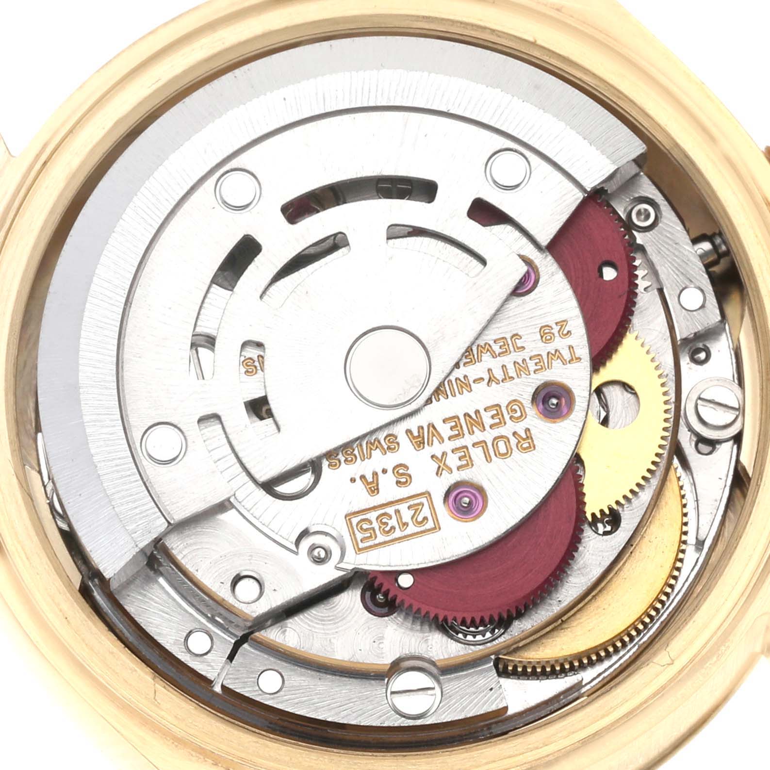 The image shows the internal mechanism of a Rolex President 69178 Women's Yellow Gold Champagne Dial 69178 Women's Yellow Gold Champagne Dial model watch, focusing on the movement and gears.