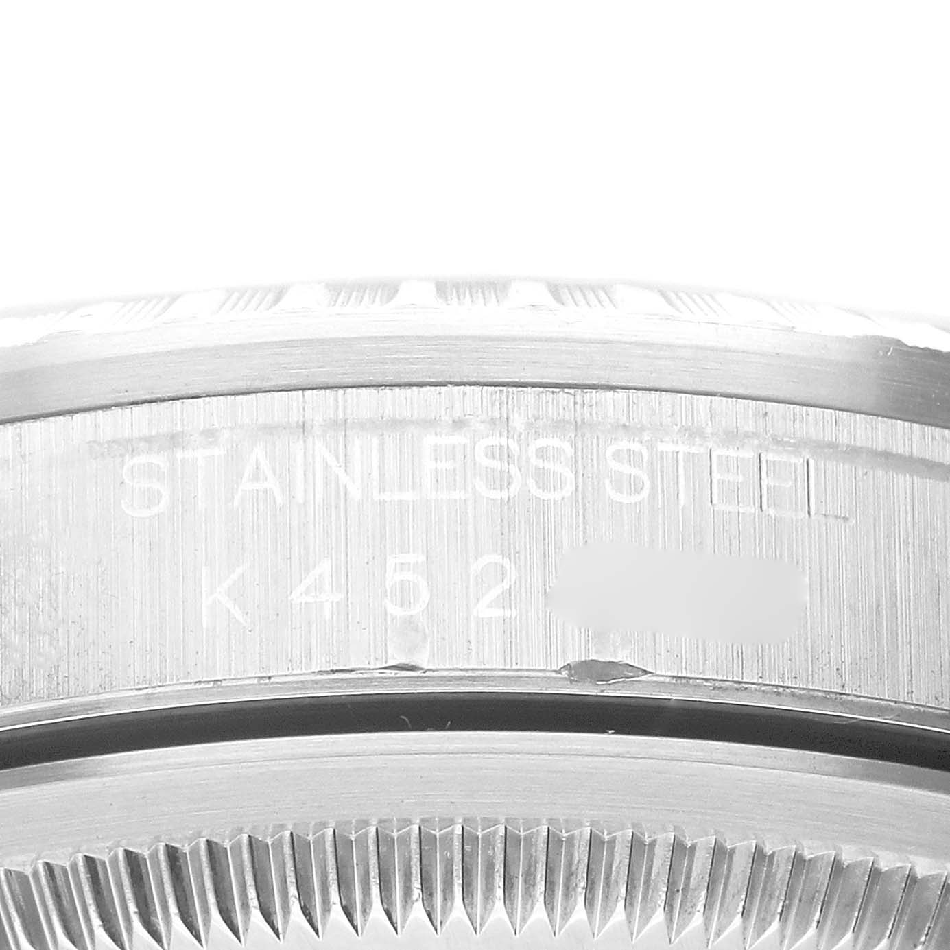 This image shows a close-up of the stainless steel back casing of a Rolex Datejust 16220 Men's Stainless Steel Silver Dial 16220 Men's Stainless Steel Silver Dial model watch, highlighting the engravings.