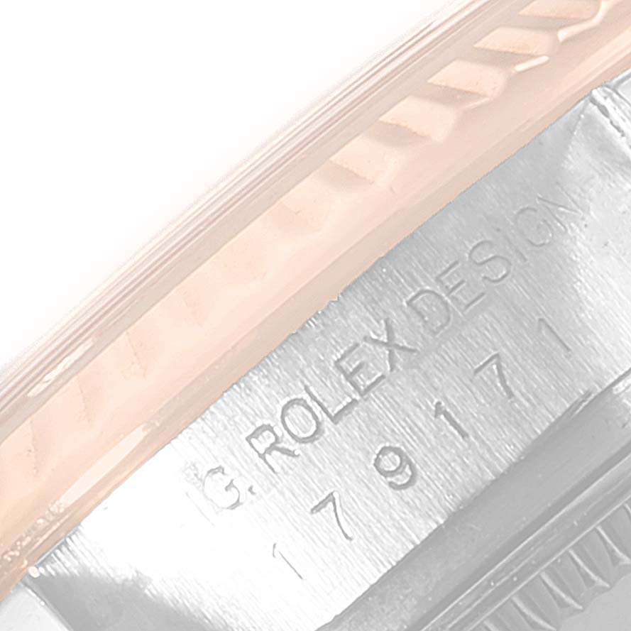 This image shows a close-up of the bezel and engraved side of a Rolex Datejust 179171 Women's Steel and Gold (two tone) Silver Dial 179171 Women's Steel and Gold (two tone) Silver Dial model watch.