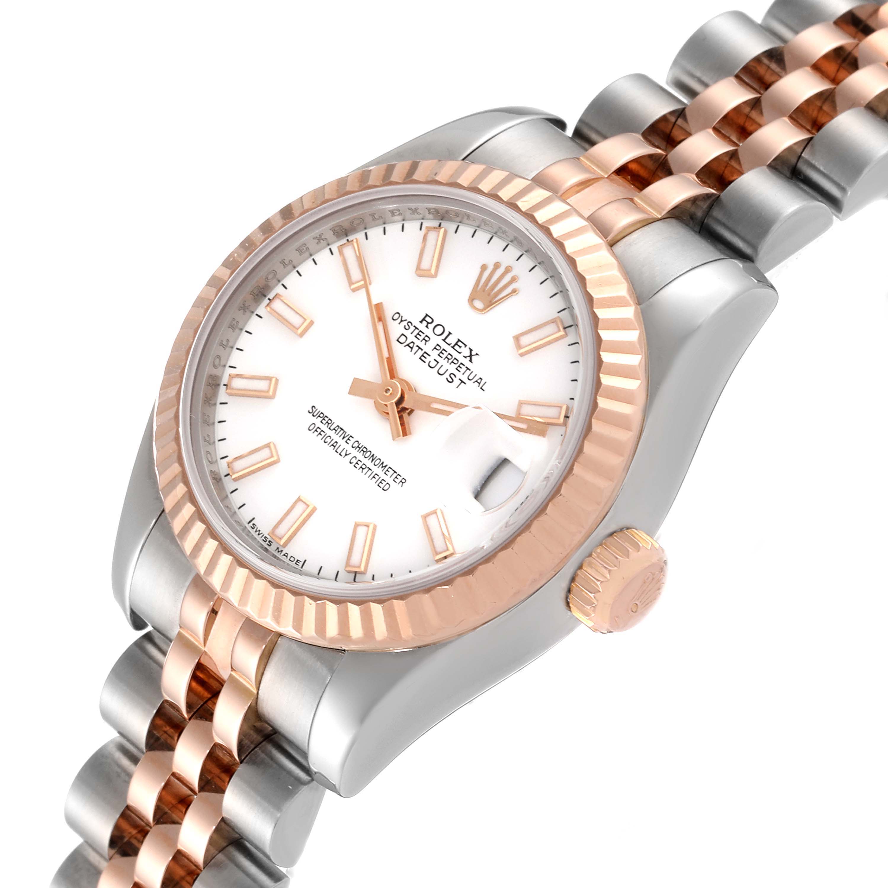 This image shows a close-up angle of a Rolex Datejust 179171 Women
s Steel and Gold (two tone) White Dial 179171 Women
s Steel and Gold (two tone) White Dial watch, focusing on its face, bezel, crown, and part of the bracelet.