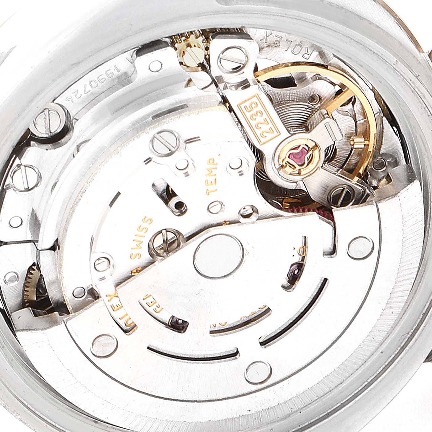 This image shows the movement mechanism of the Rolex Datejust 179171 Women
s Steel and Gold (two tone) White Dial 179171 Women
s Steel and Gold (two tone) White Dial watch, highlighting gears, screws, and the balance wheel.