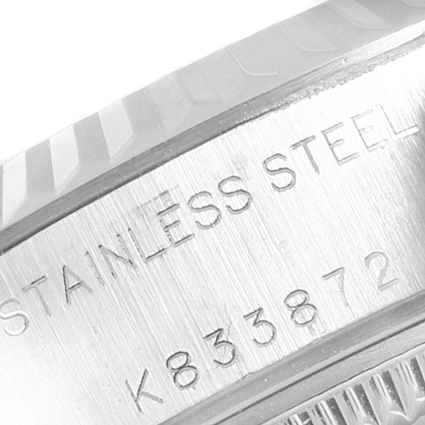 This close-up image shows the side of the case and bezel with serial number engraving of a Datejust model by Rolex.