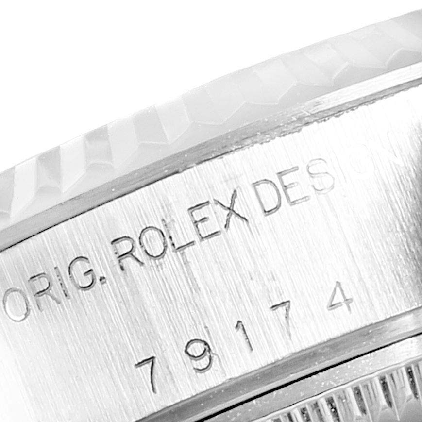 The image shows a close-up of the engraved side of a Datejust model by Rolex, displaying "ORIG. ROLEX DESIGN" and the model number 79174.