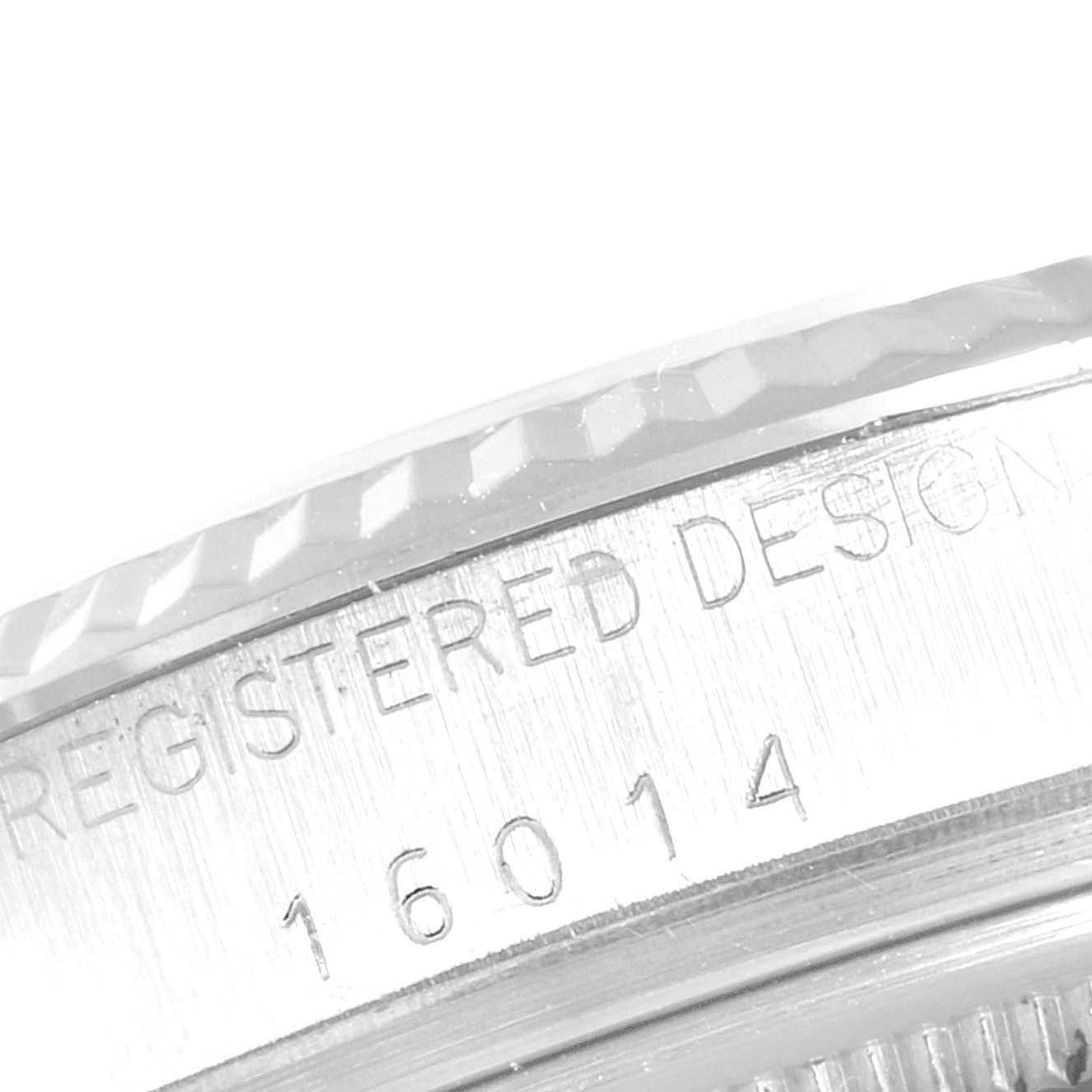 The image shows a detailed view of the engraved case back bezel of the Rolex Vintage Collection 16014 Men
s Stainless Steel Silver Dial 16014 Men
s Stainless Steel Silver Dial model 16014.