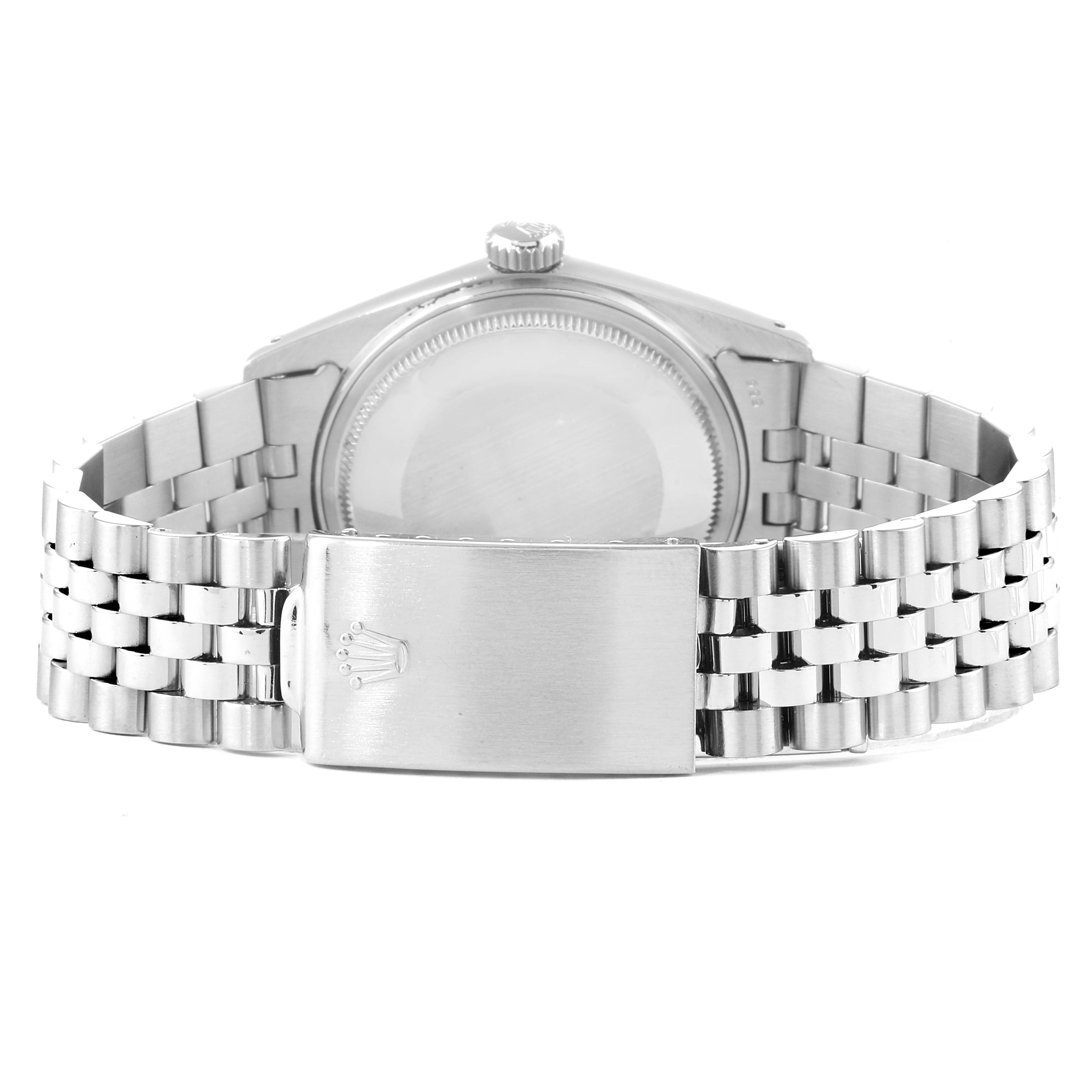 The image shows the back of a Rolex Vintage Collection 16014 Men
s Stainless Steel Silver Dial 16014 Men
s Stainless Steel Silver Dial watch, highlighting its clasp and bracelet.