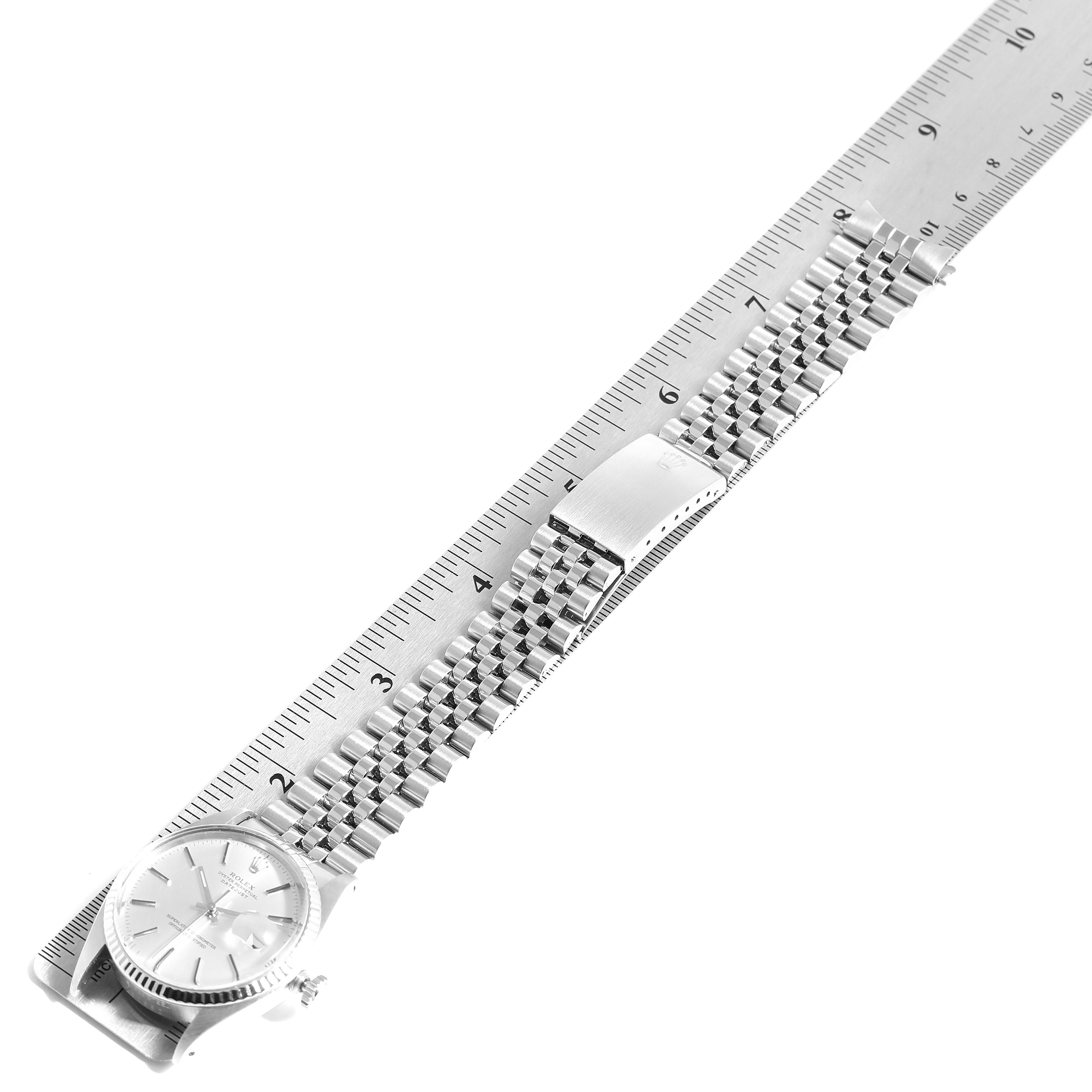 The Rolex Vintage Collection 16014 Men
s Stainless Steel Silver Dial 16014 Men
s Stainless Steel Silver Dial model watch is shown flat, with its face and full metal bracelet displayed alongside a ruler for scale.