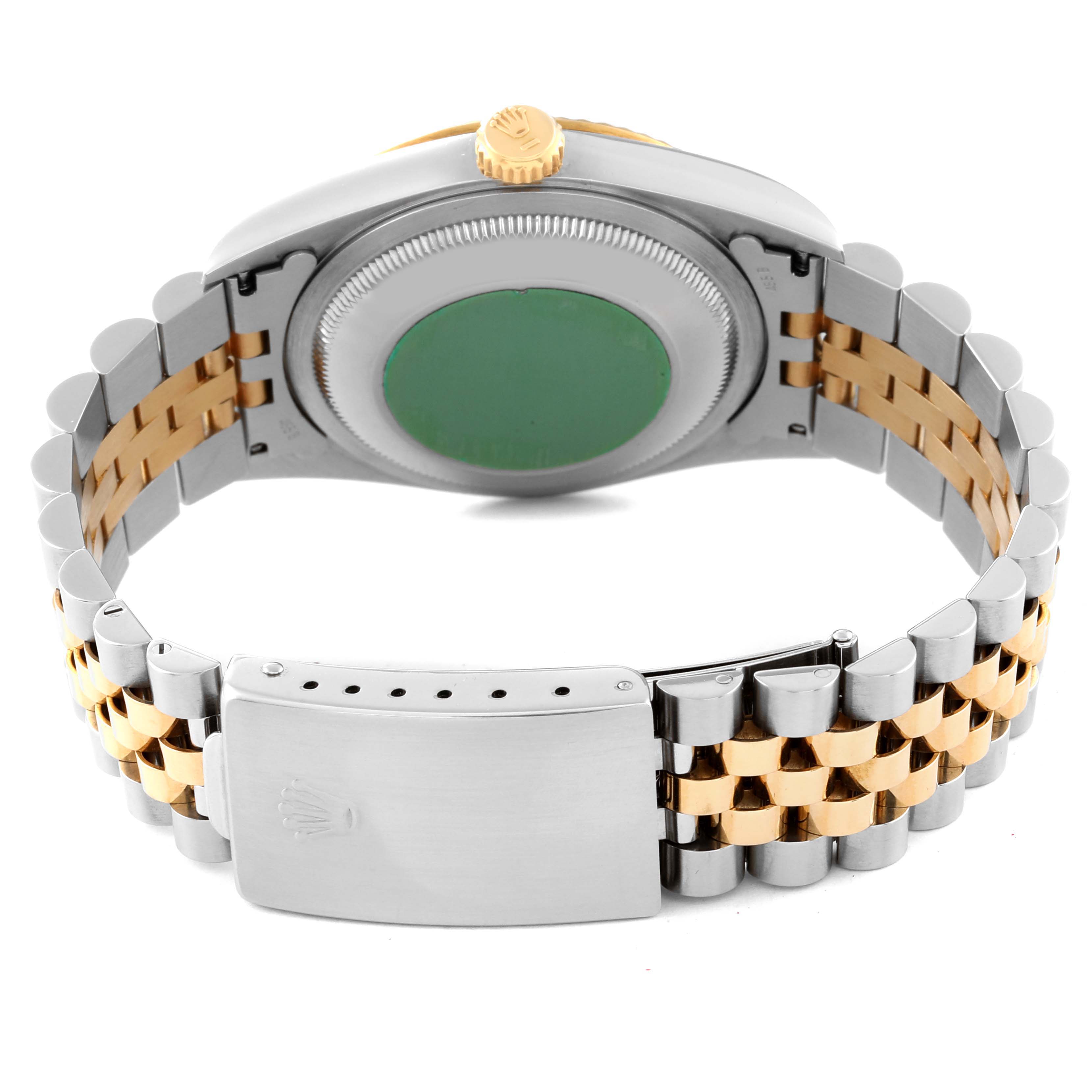 This image shows the back of a Rolex Datejust 16233 Men's Steel and Gold (two tone) Blue Dial 16233 Men's Steel and Gold (two tone) Blue Dial watch focusing on the case back, crown, and two-tone Jubilee bracelet.