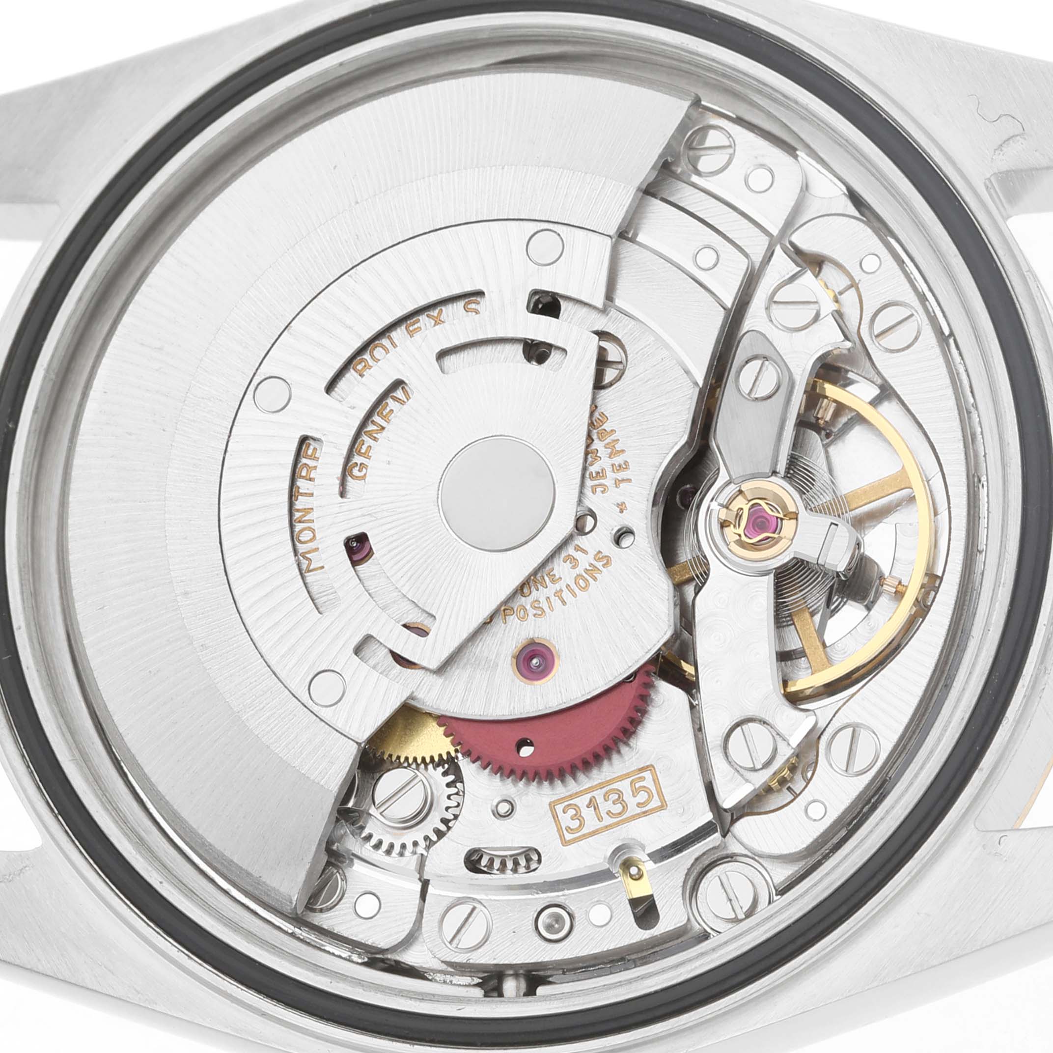 The image shows the movement mechanism of a Rolex Datejust 16233 Men's Steel and Gold (two tone) Champagne Dial, viewed from the back, highlighting gears and the rotor.