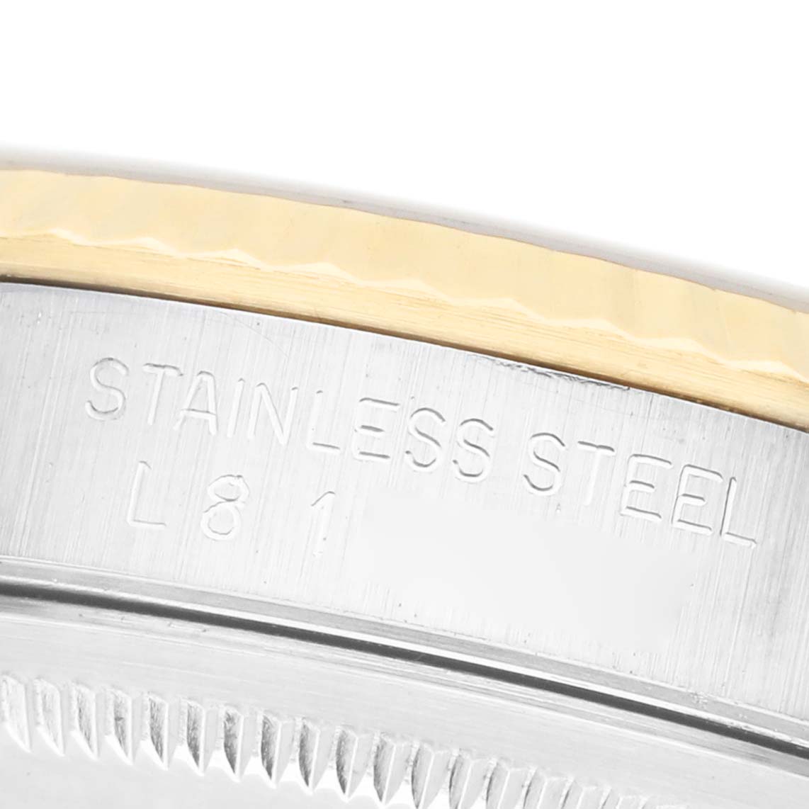 The image shows a close-up of the Rolex Datejust 16233 Men's Steel and Gold (two tone) Champagne Dial metal case, highlighting its stainless steel engraving and gold-tone edge.
