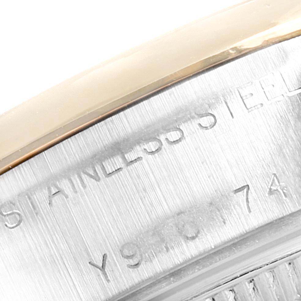 This image shows a close-up of the case side and serial number area of a Rolex Datejust 79163 Women's Steel and Gold (two tone) White Dial 79163 Women's Steel and Gold (two tone) White Dial watch.
