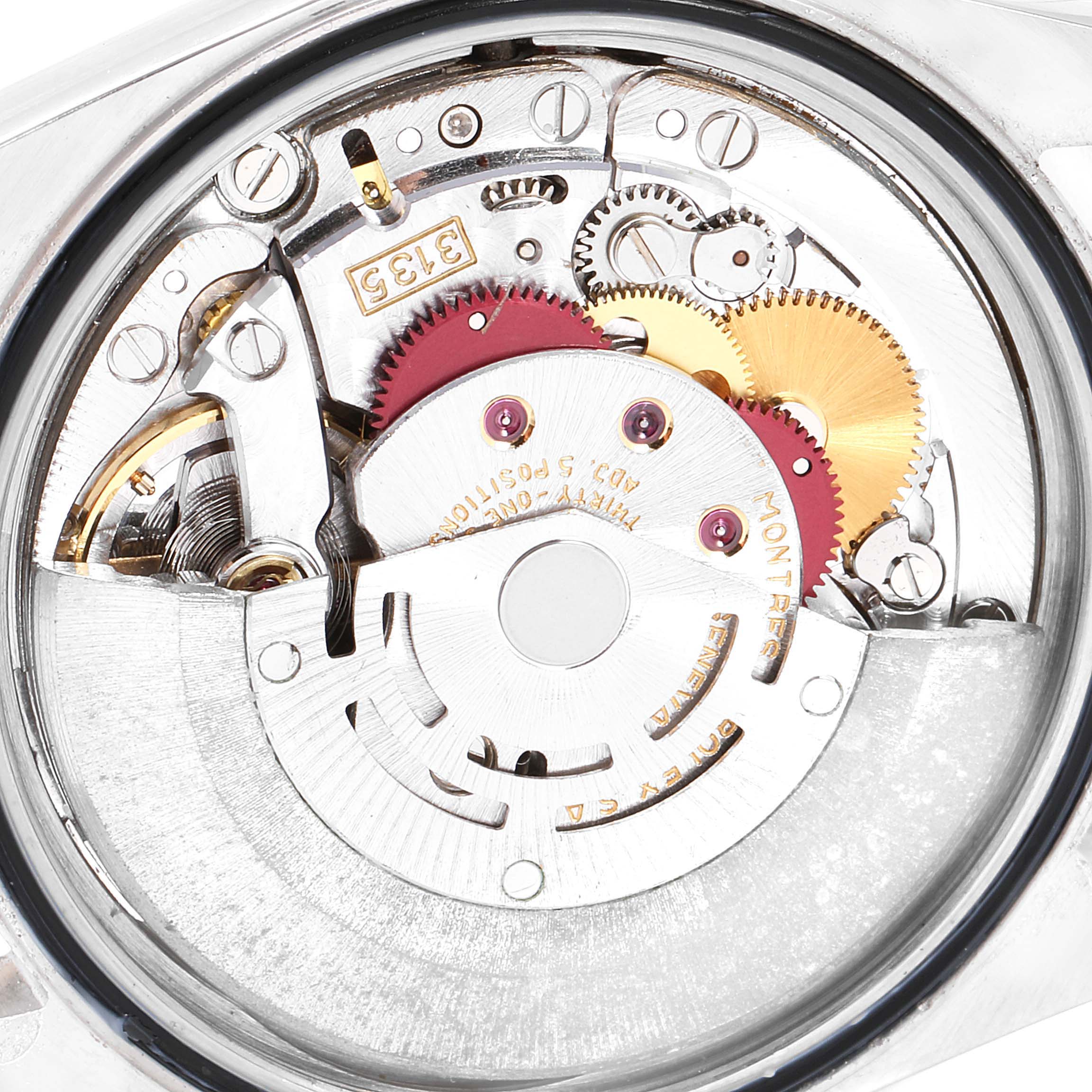 This image shows the internal mechanism and parts of a Rolex Datejust 16233 Men
s Steel and Gold (two tone) Blue Dial 16233 Men
s Steel and Gold (two tone) Blue Dial watch from a close-up perspective.