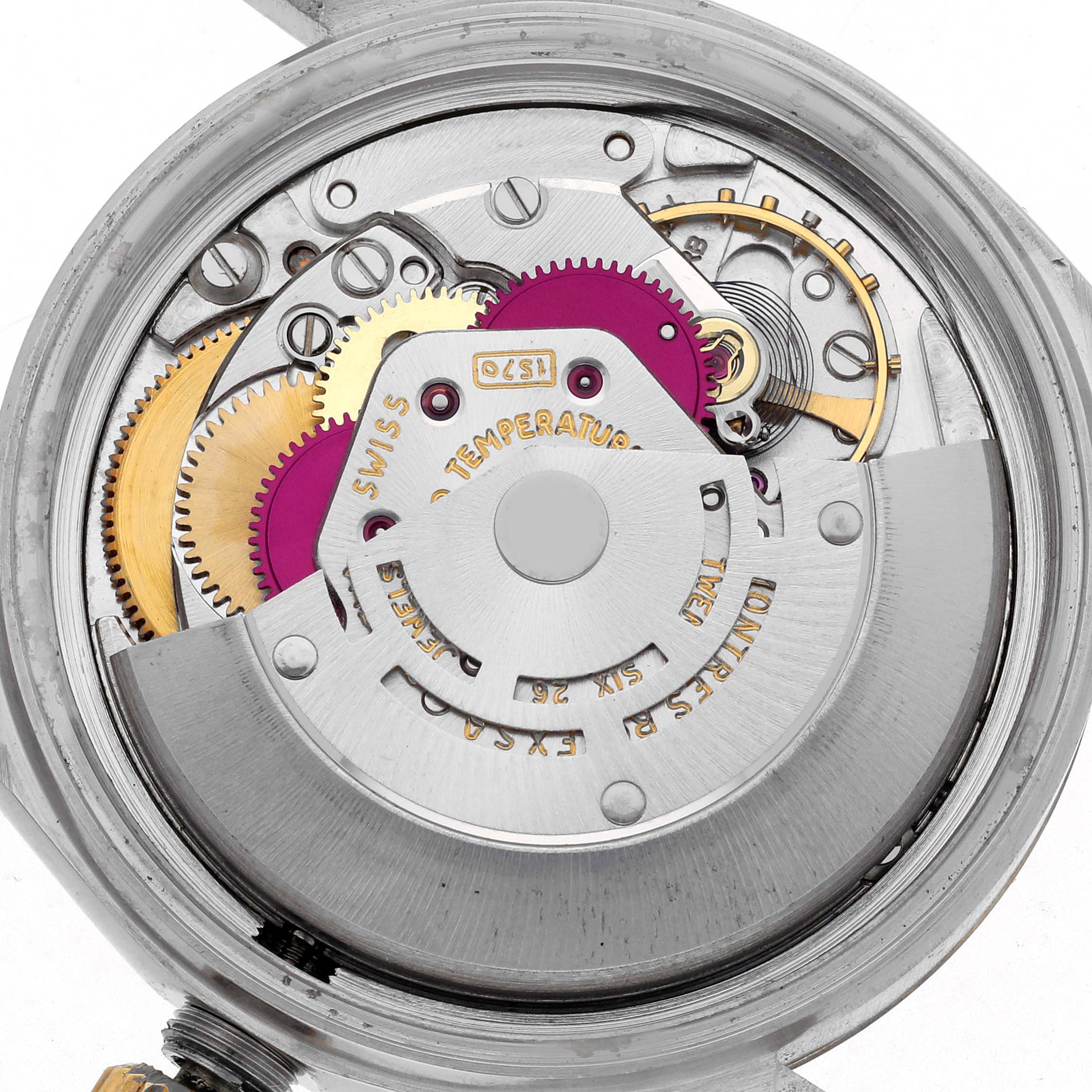 The image shows the inner mechanical movement of the Rolex Datejust 1601 Men's Steel and Gold (two tone) Champagne Dial 1601 Men's Steel and Gold (two tone) Champagne Dial watch from a top-down angle, displaying gears and components.