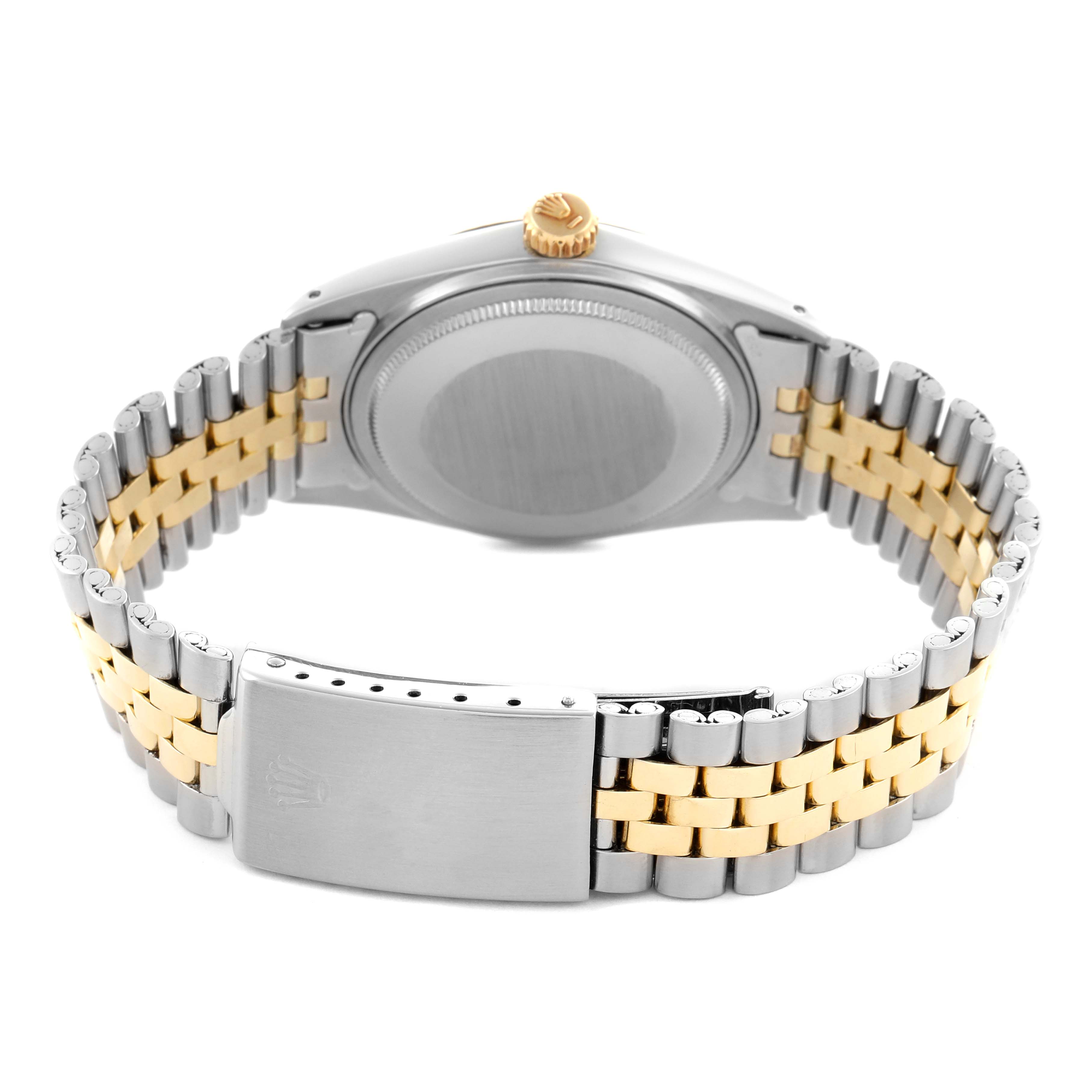 The Rolex Datejust 1601 Men's Steel and Gold (two tone) Champagne Dial 1601 Men's Steel and Gold (two tone) Champagne Dial watch is shown from the back, highlighting the case back, Jubilee bracelet, and clasp.