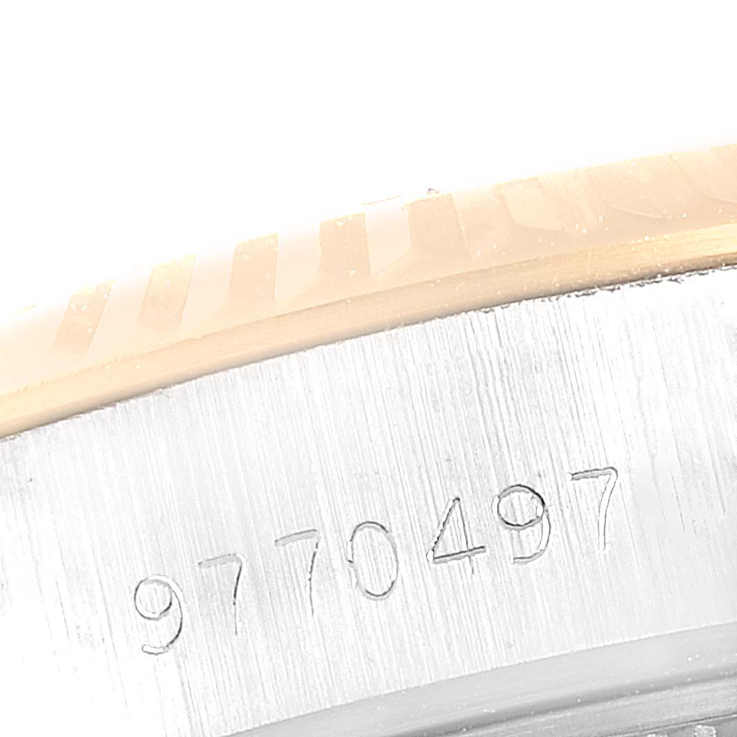 This image shows a close-up of the serial number engraving on the side of a Rolex Datejust 69173 Women
s Steel and Gold (two tone) White Dial 69173 Women
s Steel and Gold (two tone) White Dial watch.