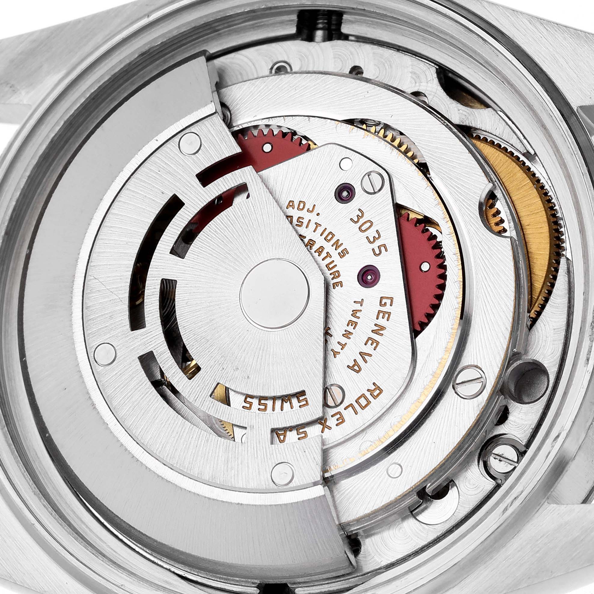 The image shows the internal mechanism of a Rolex Vintage Collection 16013 Men's Steel and Gold (two tone) White Dial 16013 Men's Steel and Gold (two tone) White Dial model, including gears and the rotor at a close-up angle.