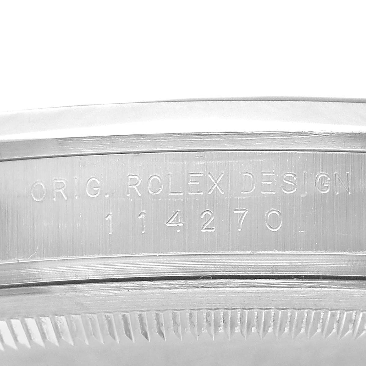 The image shows the engraved side of a Rolex Explorer 114270 Men's Stainless Steel Black Dial watch case with the model number 114270.