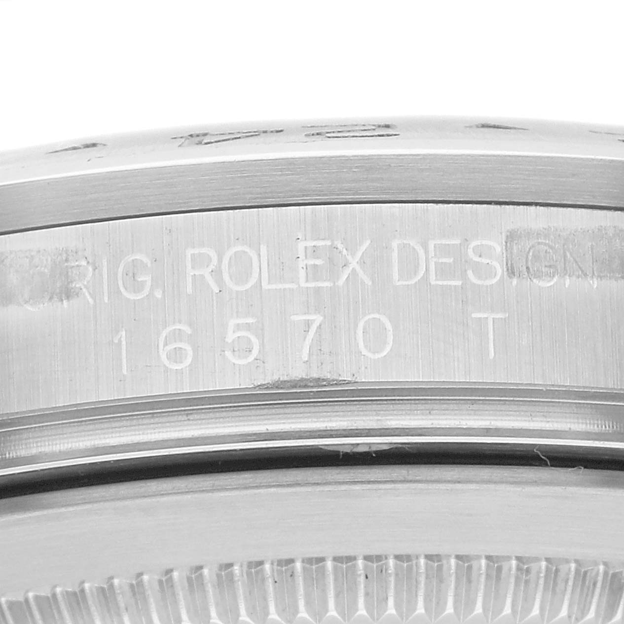 The image shows a close-up of the case side of the Rolex Explorer 16570 Men
s Stainless Steel Black Dial 16570 Men
s Stainless Steel Black Dial, displaying the model number and "ORIG. ROLEX DESIGN."