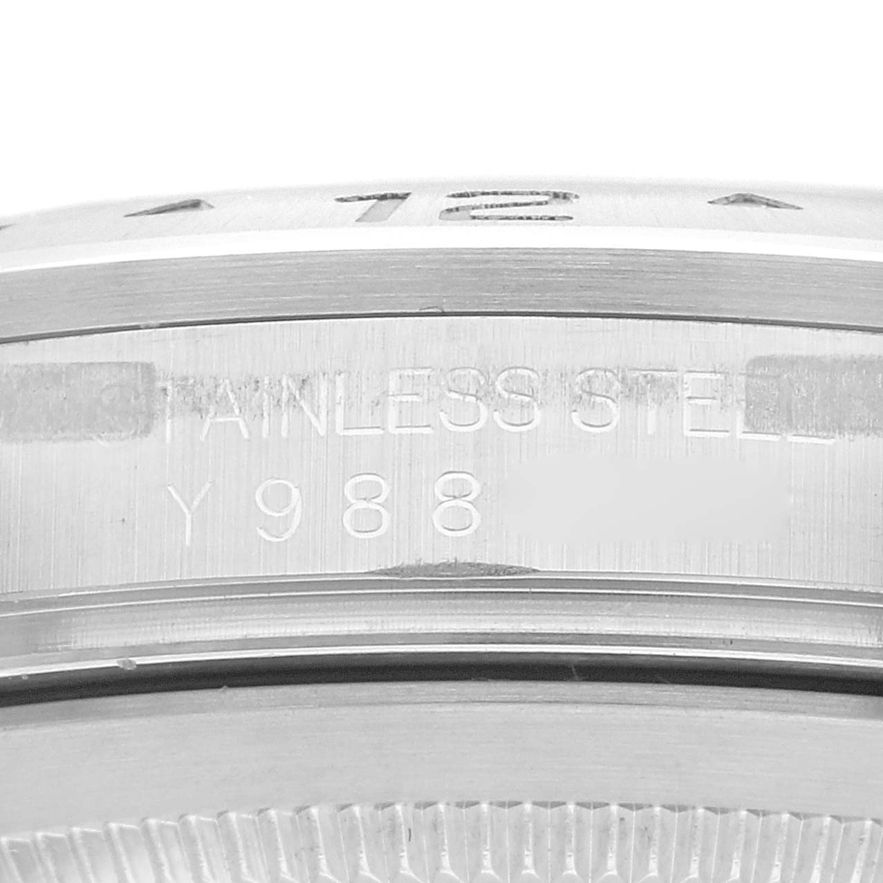 This close-up image of the Rolex Explorer 16570 Men
s Stainless Steel Black Dial 16570 Men
s Stainless Steel Black Dial watch shows the case side engravings and part of the bezel.