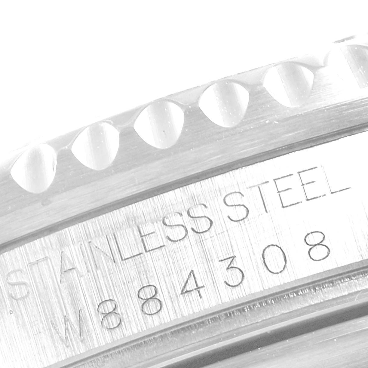 This close-up image shows the engraved side of the case and bezel of a Rolex GMT-Master 16710 Men
s Stainless Steel Black Dial 16710 Men
s Stainless Steel Black Dial watch.